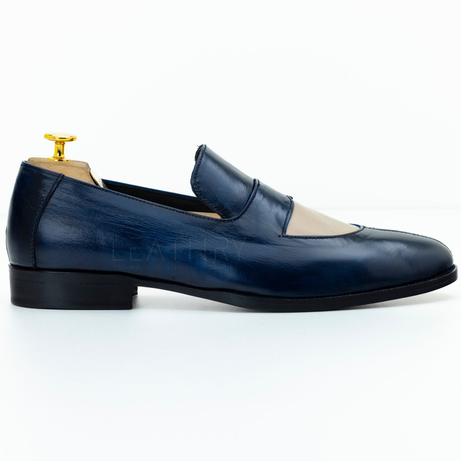 Blue leather loafer shoe on a white background