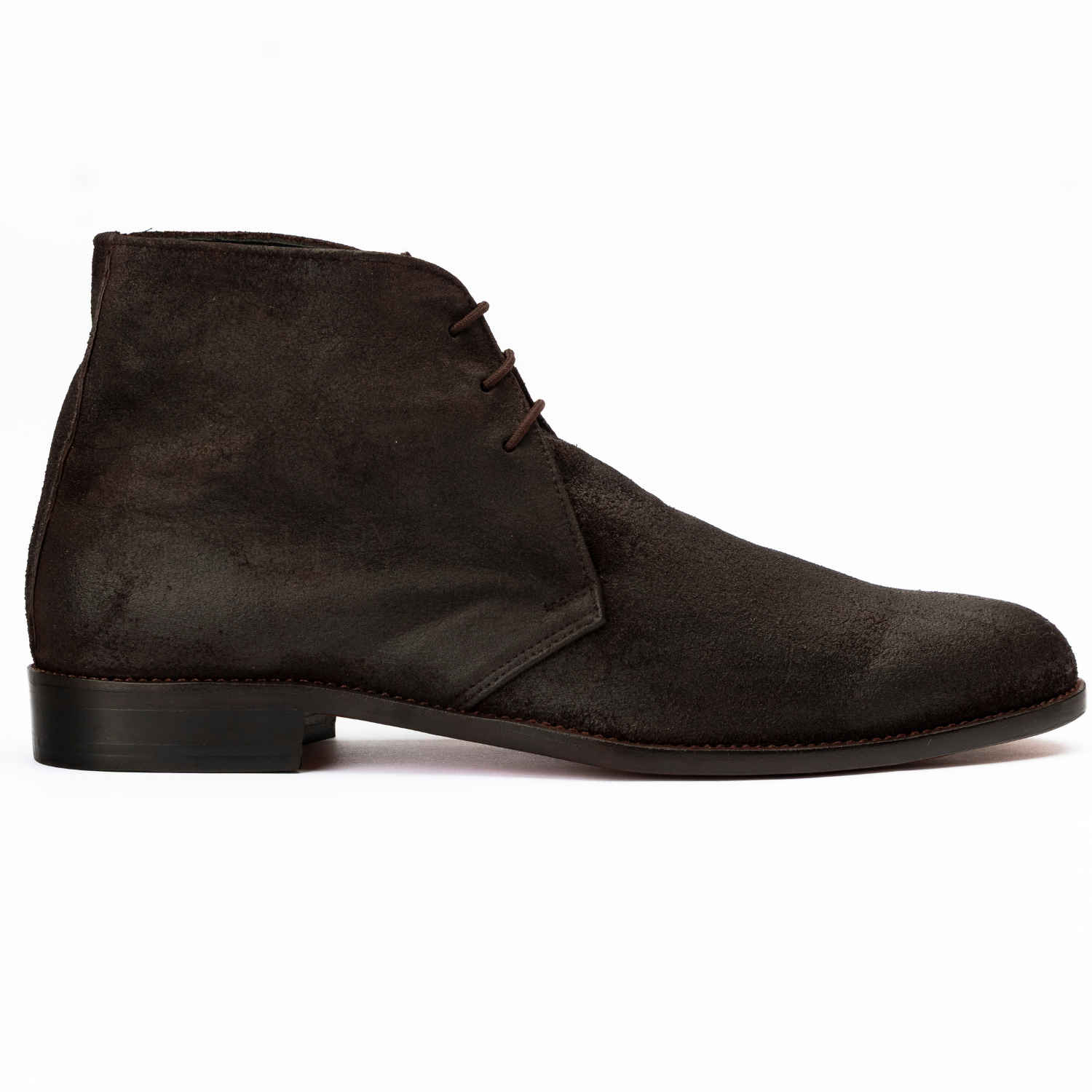 Dark brown suede chukka boot on a white background