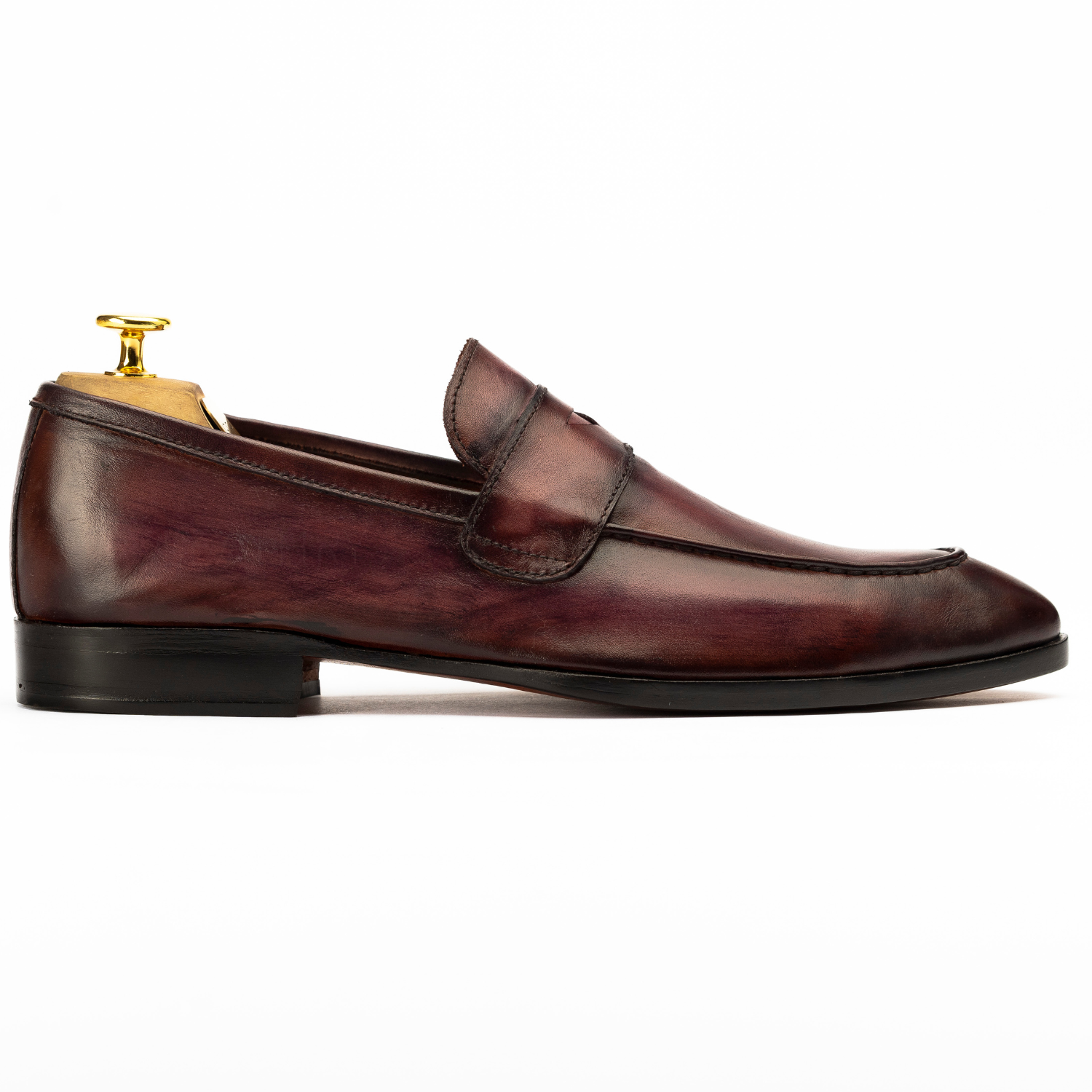 Brown leather loafer shoe on a white background
