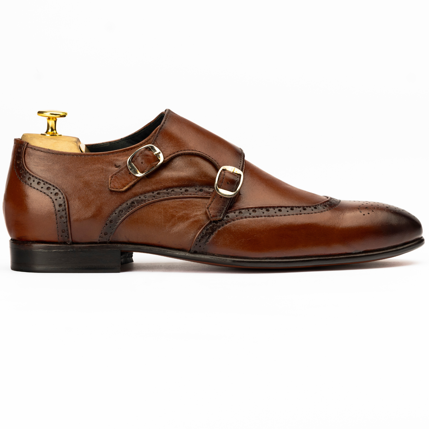 Brown leather dress shoe with gold buckle on a white background