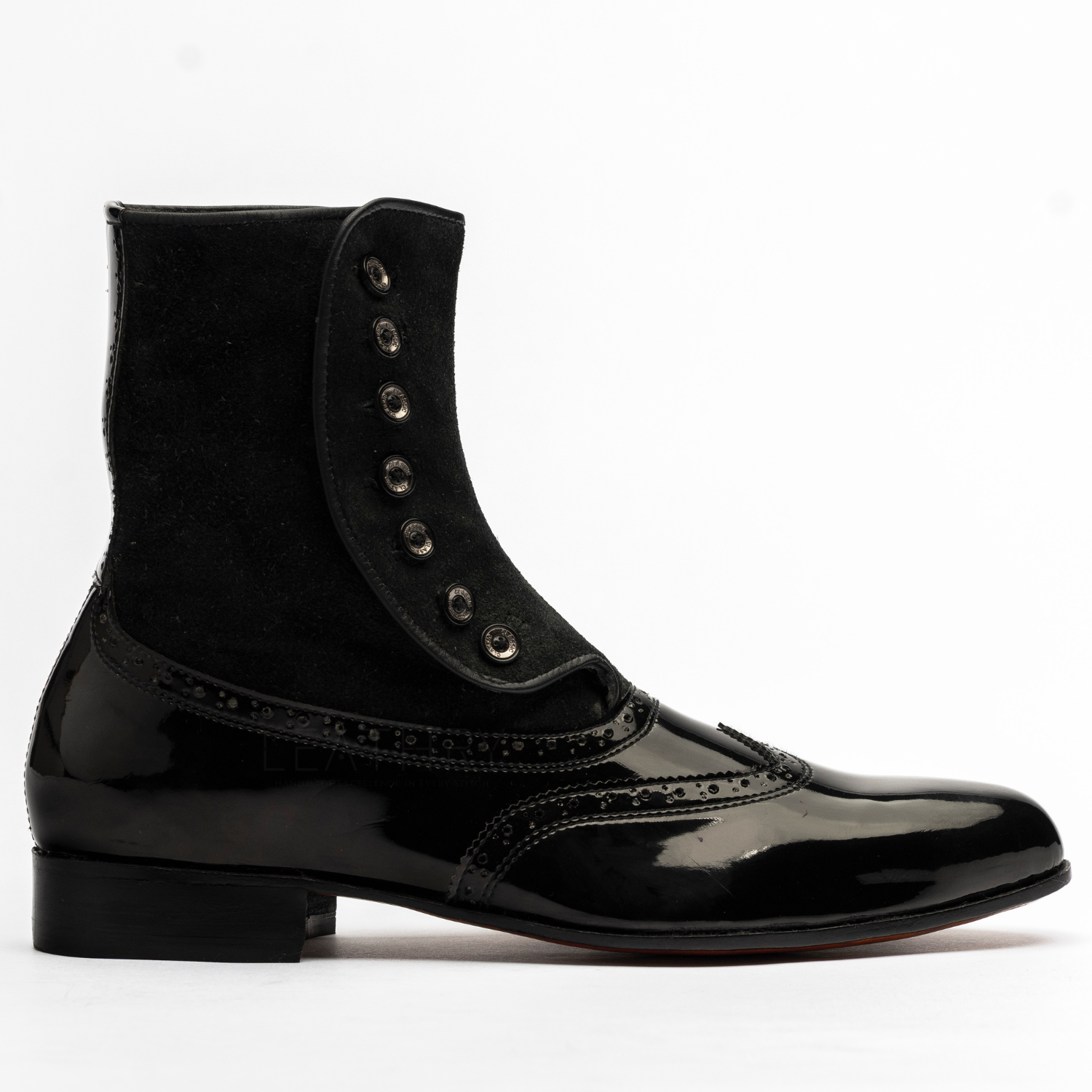 Black patent leather boot with a shiny finish on a white background