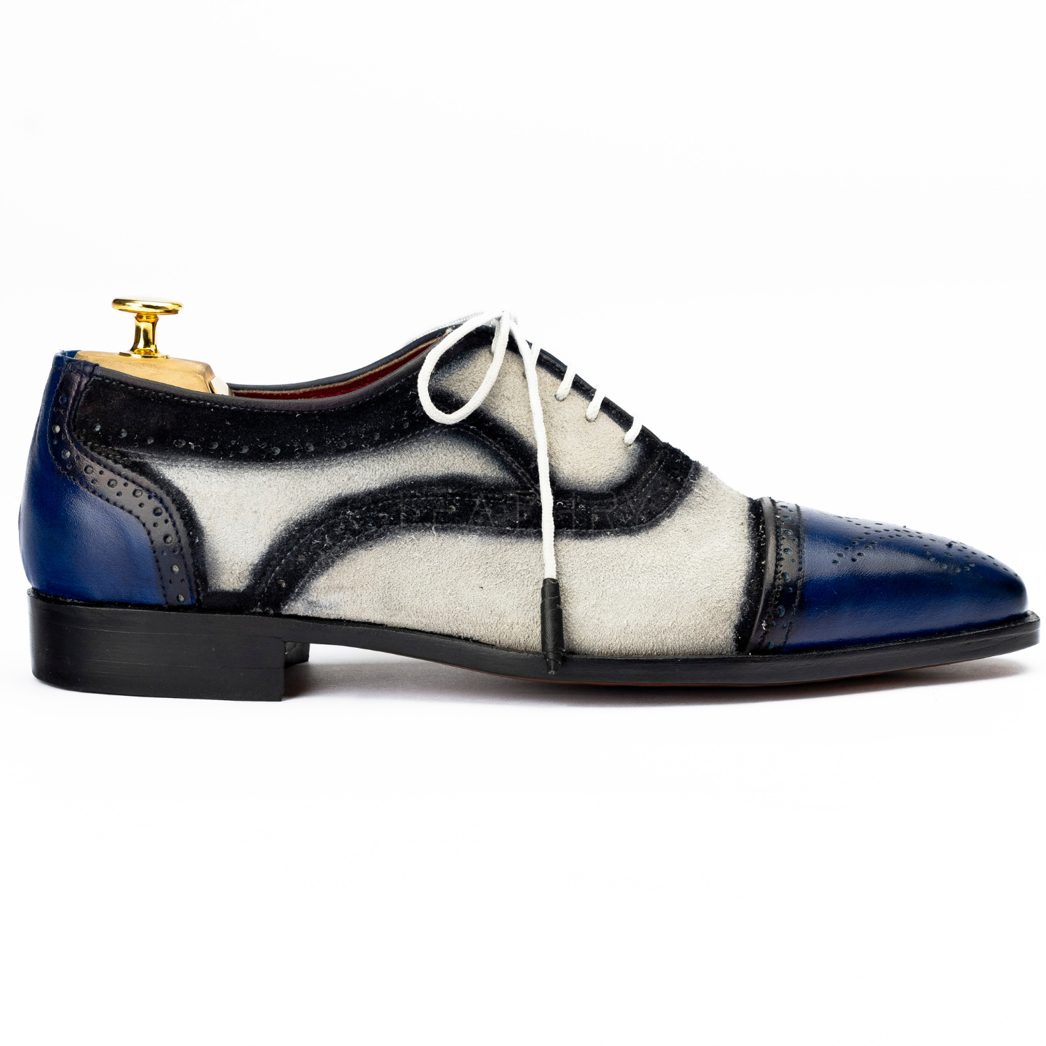 Blue and white dress shoe on a white background