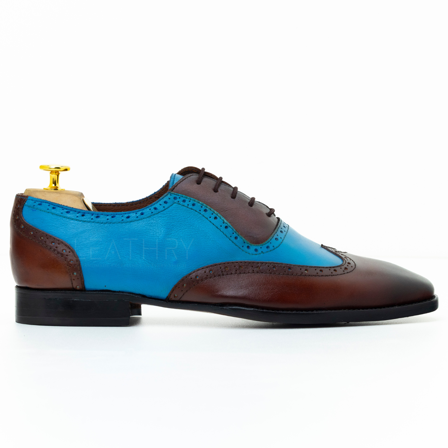 Blue and brown dress shoe with 'Athry' branding on a white background