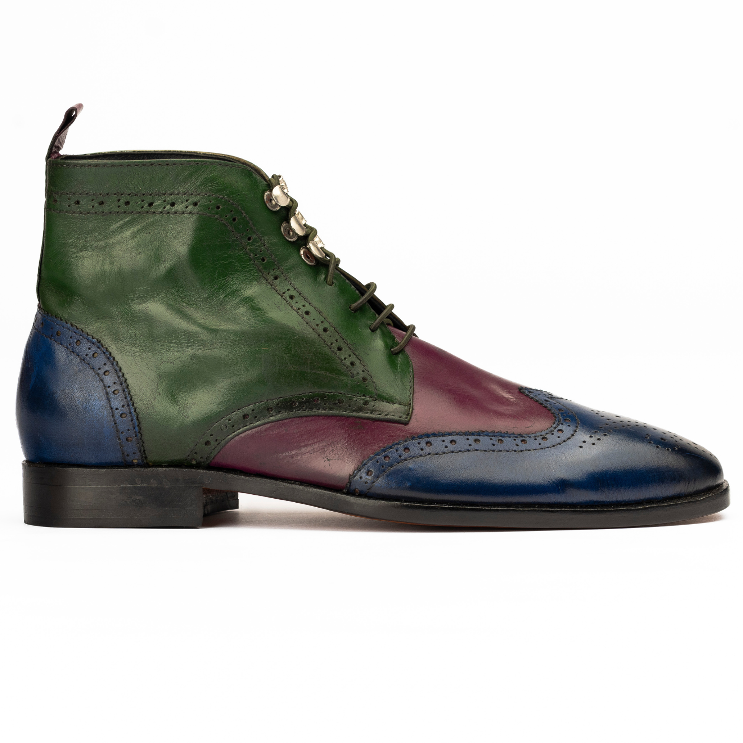 Multicolored leather shoe with green, blue, and burgundy colors on a white background