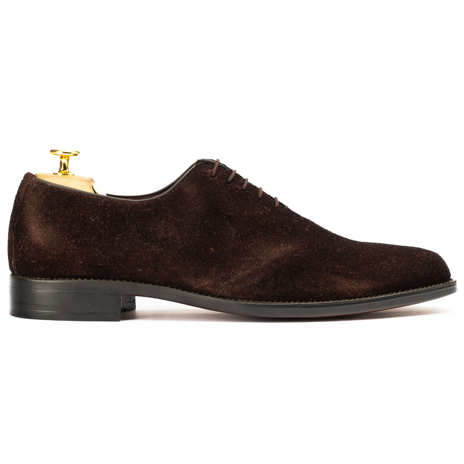 Brown suede dress shoe on a white background