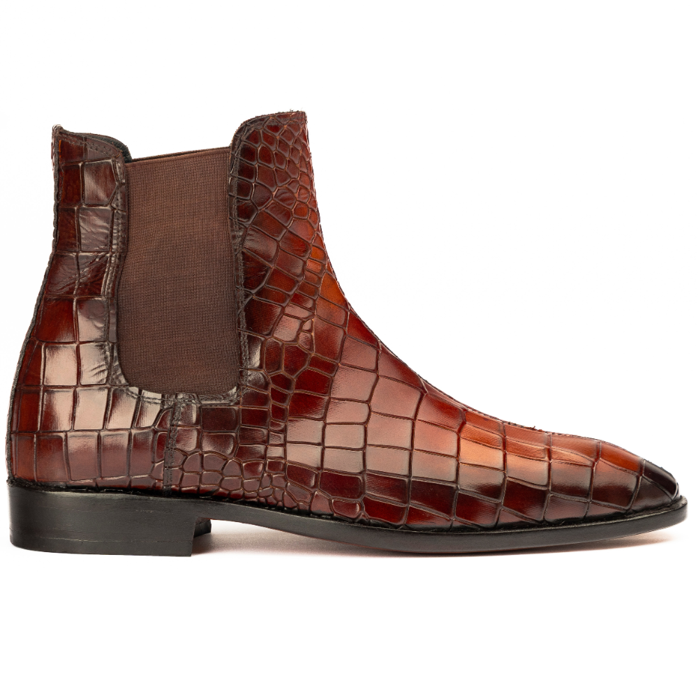 Brown crocodile-patterned leather boot on a white background