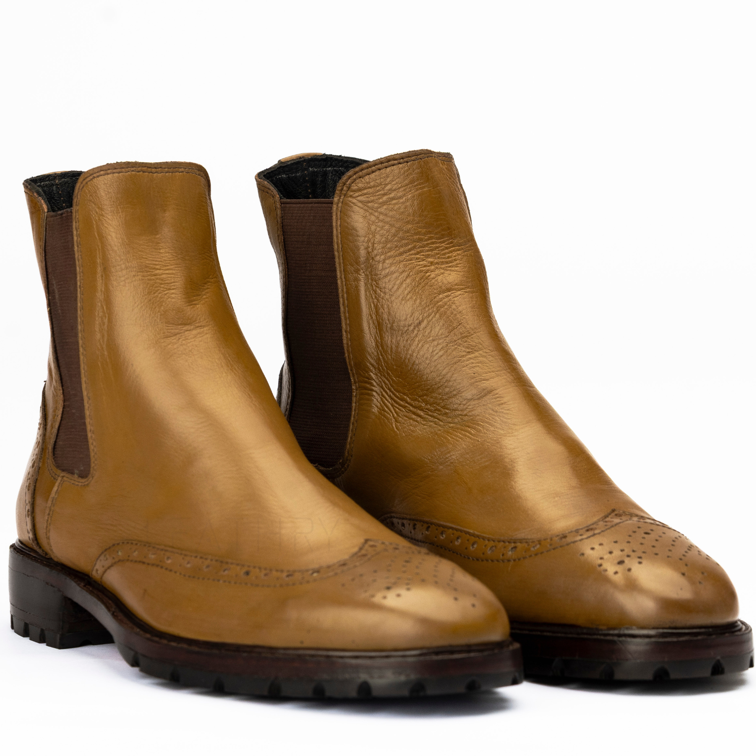 Pair of brown leather boots on a white background