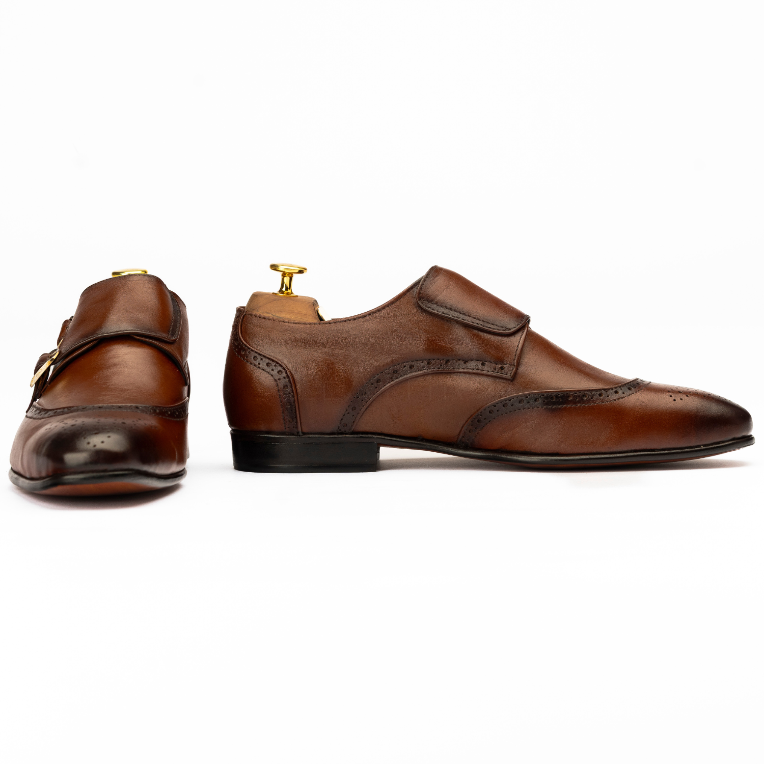 Pair of brown leather shoes on a white background