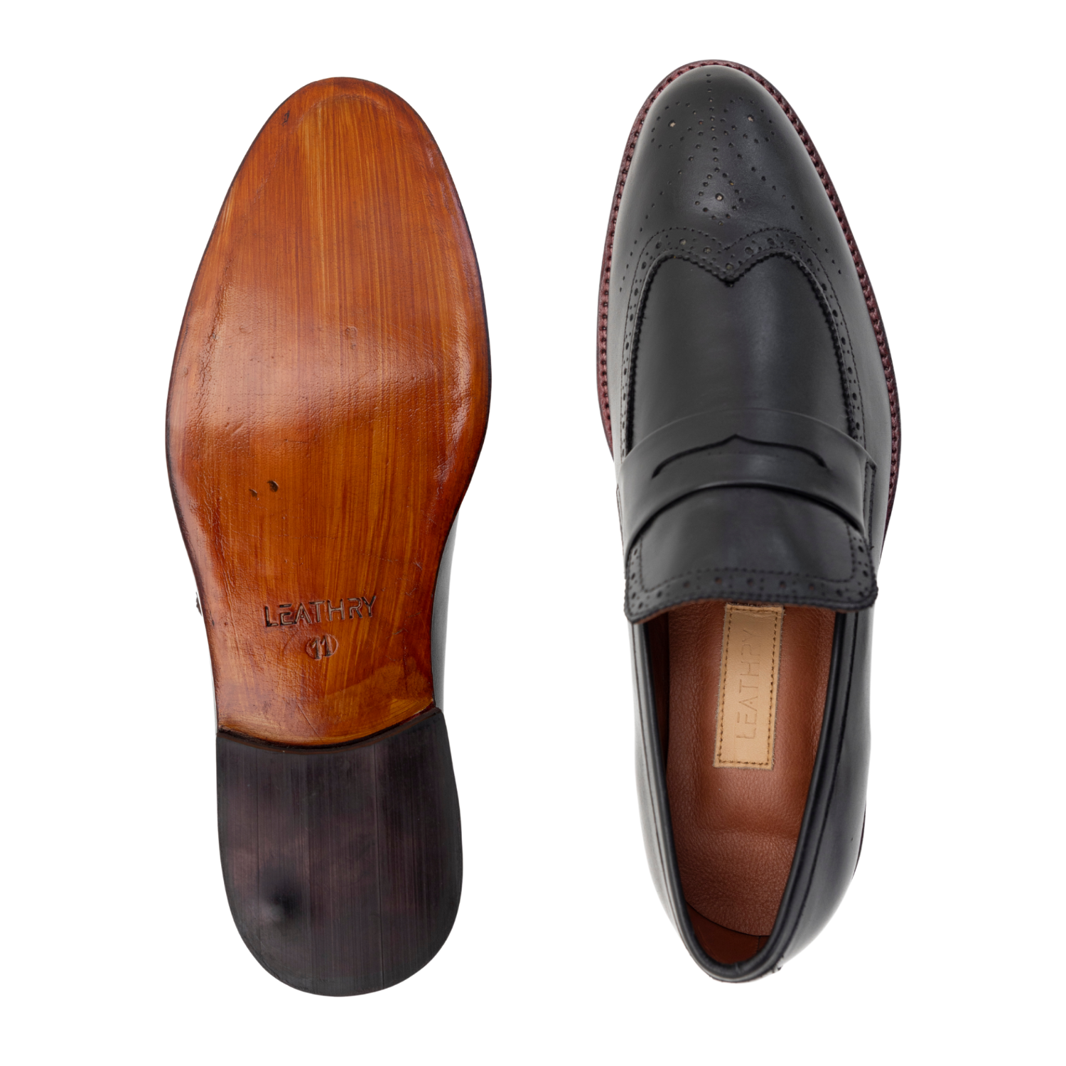 Black leather loafer shoe with wooden sole on a white background