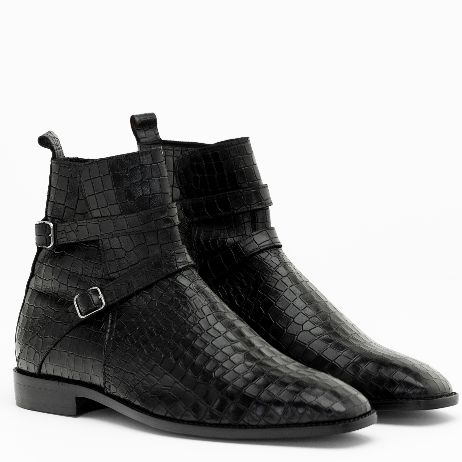 Black crocodile-patterned boots with buckles on a white background