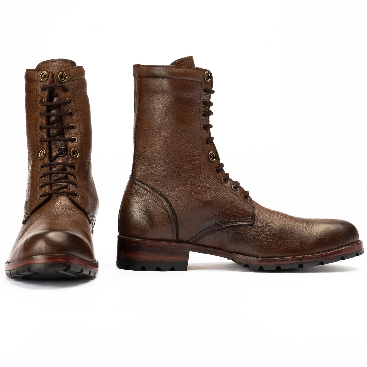 Pair of brown leather boots on a white background