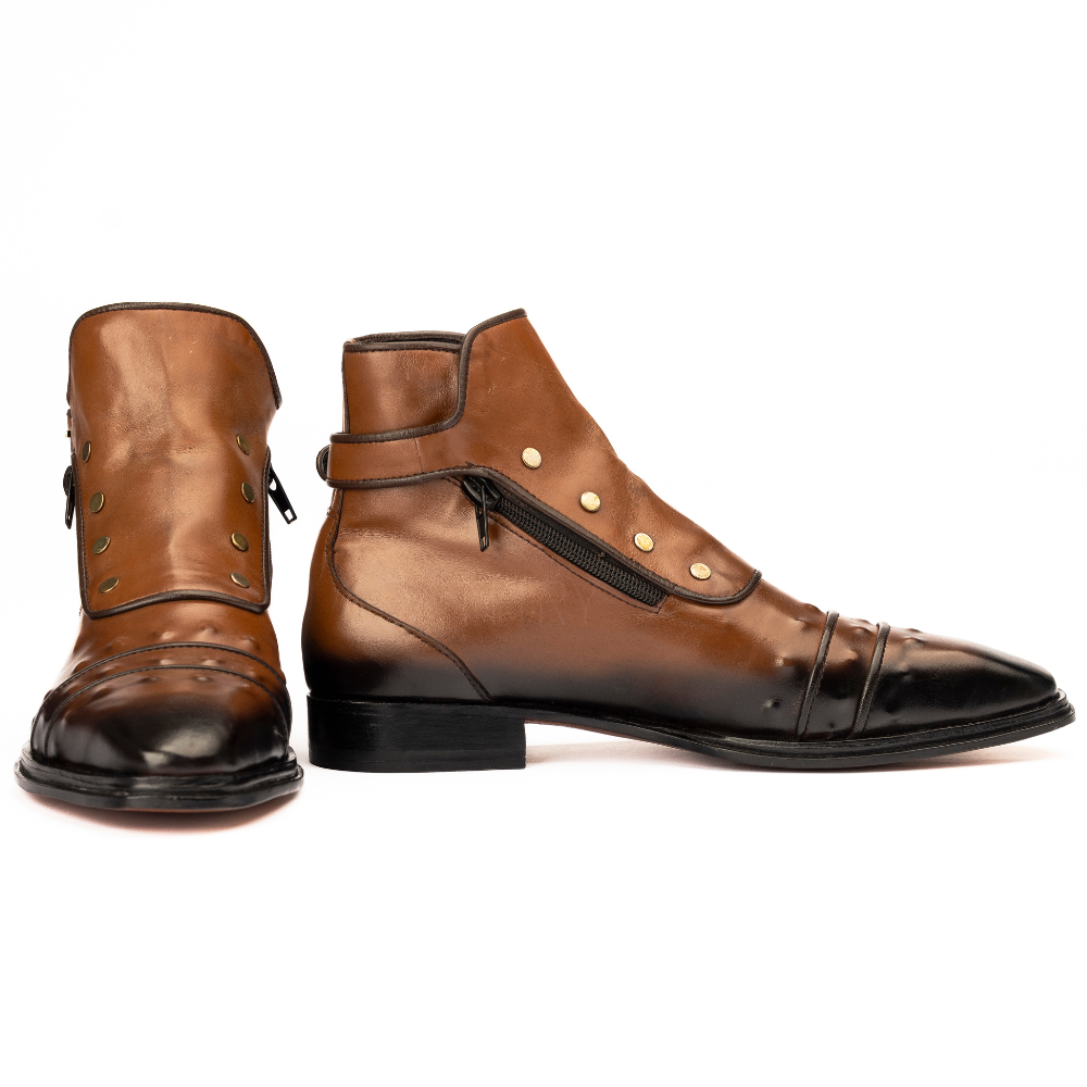 Pair of brown leather boots with black soles on a white background