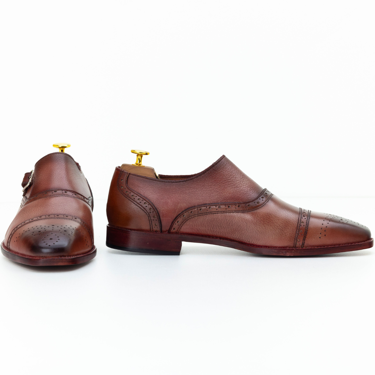 Pair of brown leather shoes on a white background