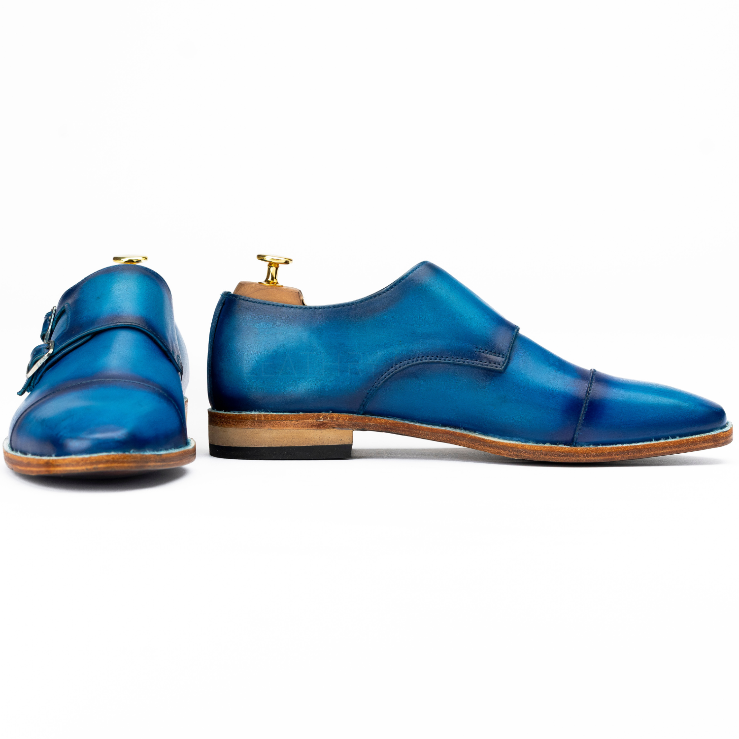 Pair of blue leather shoes on a white background