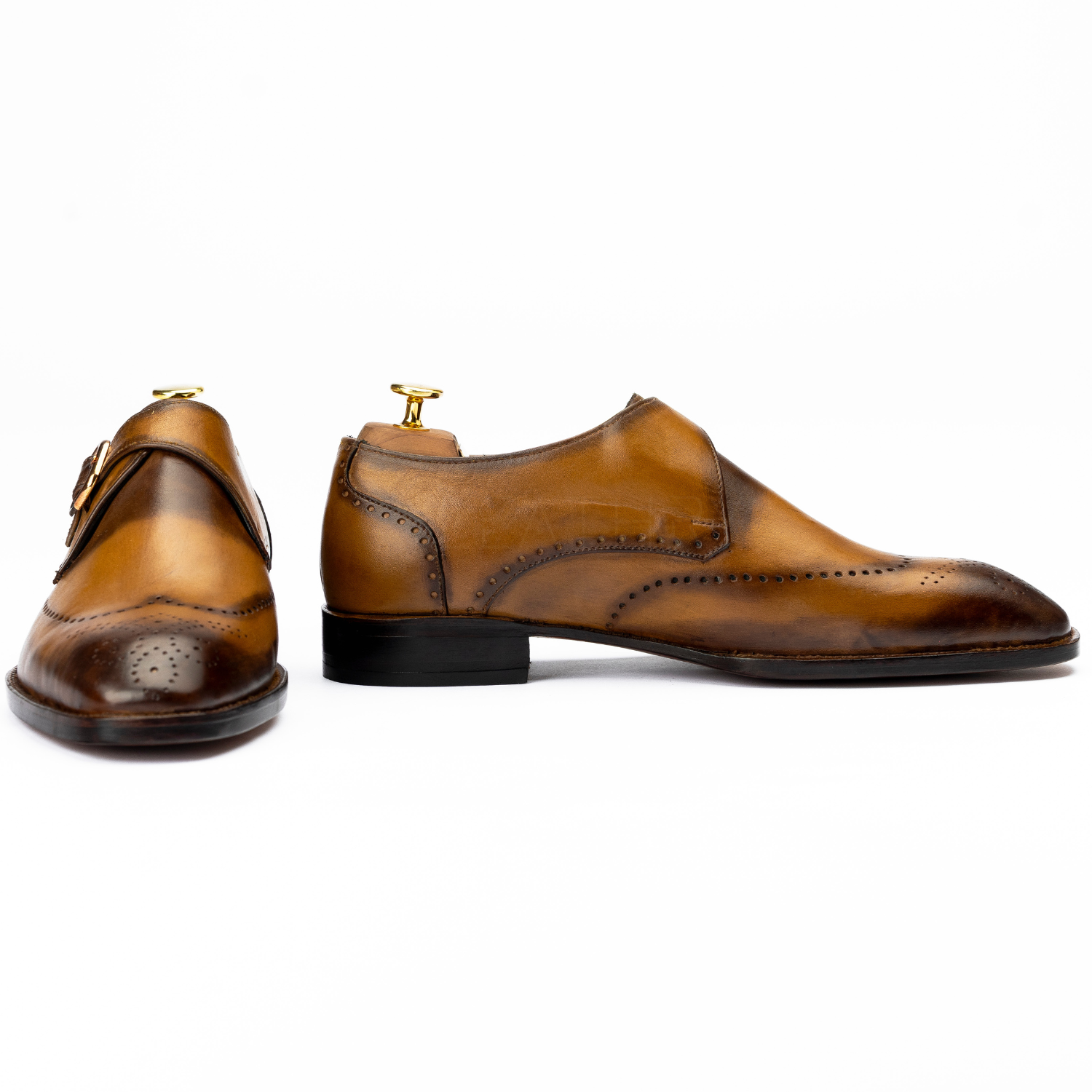 Pair of brown leather shoes on a white background