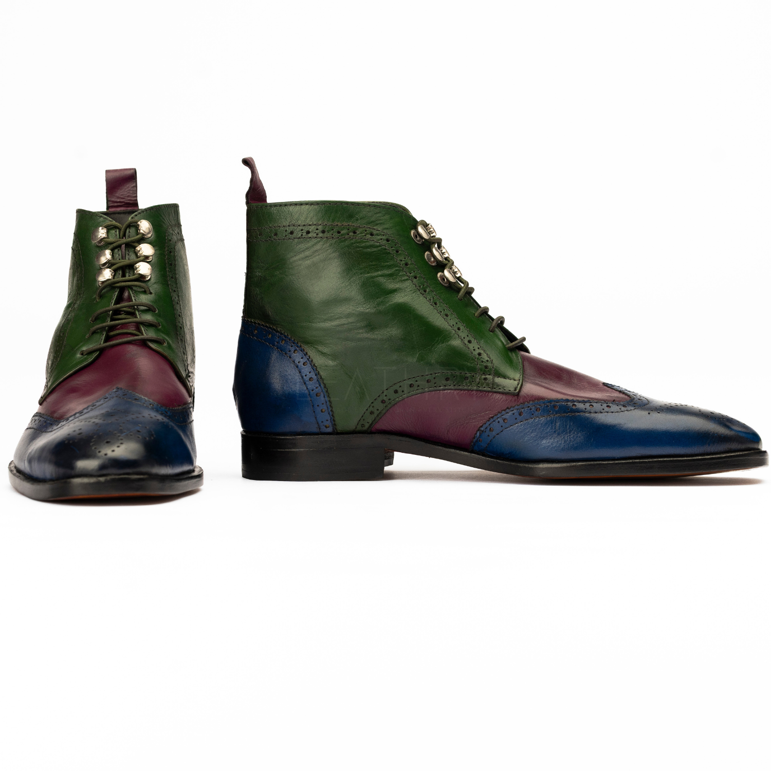 Green, purple, and blue leather shoes on a white background