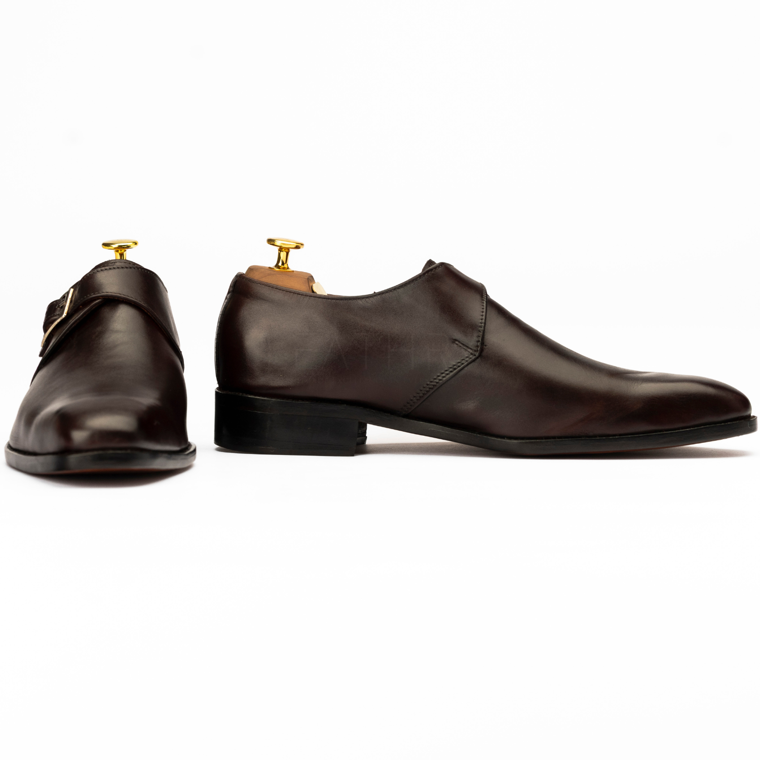 Pair of brown leather shoes on a white background