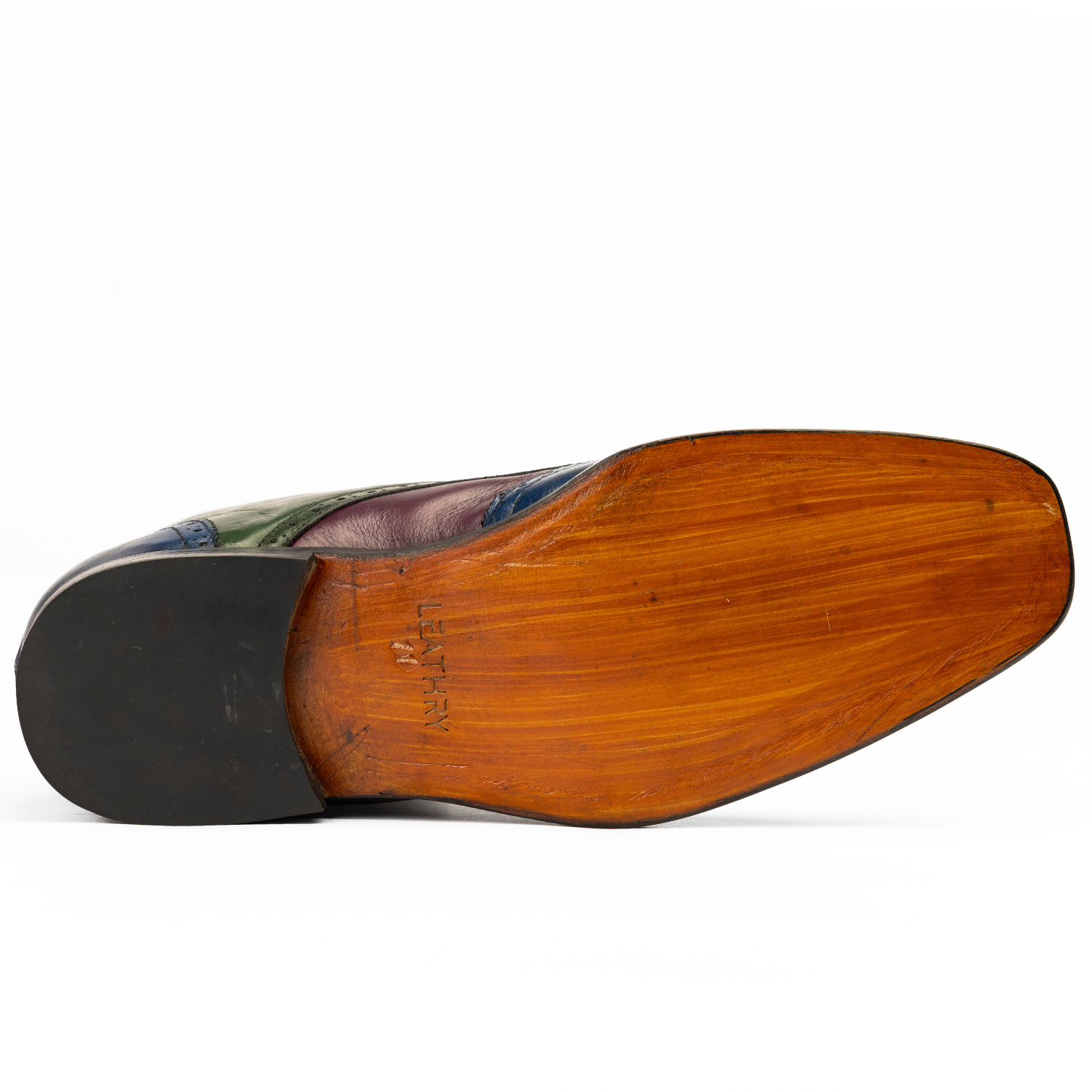 Close-up of a wooden shoe sole on a white background