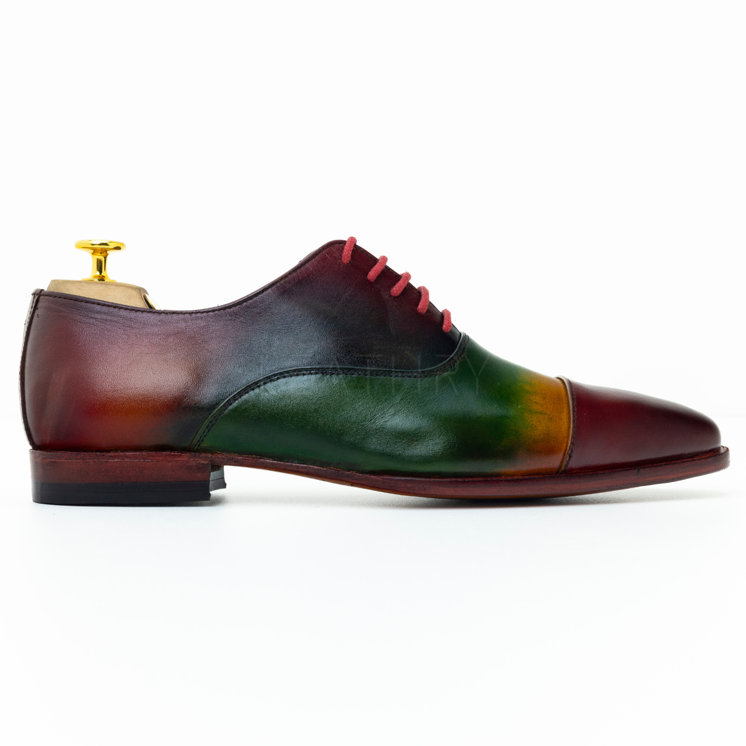 Multicolored leather shoe with a white background