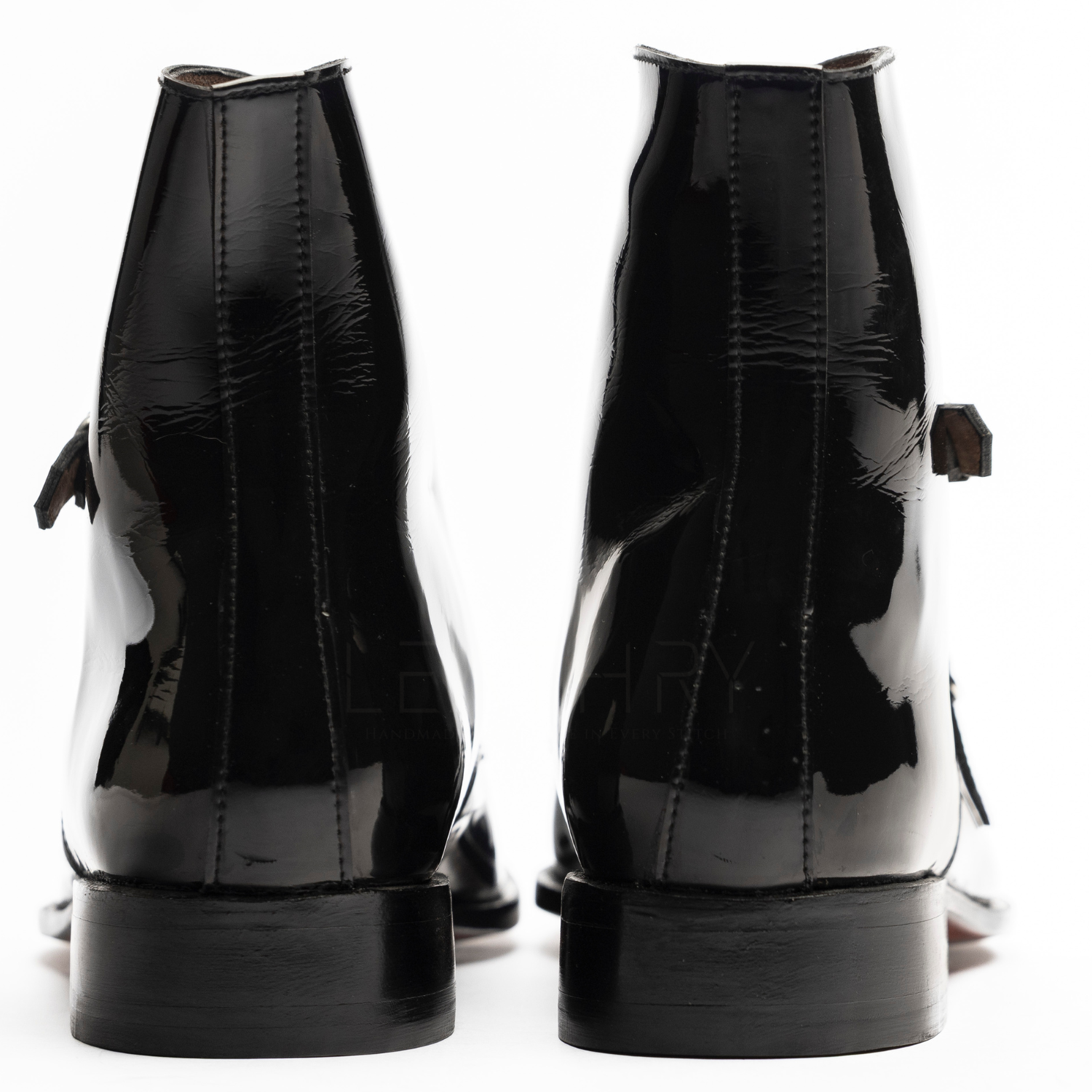 Black patent leather boots shown from multiple angles on a white background