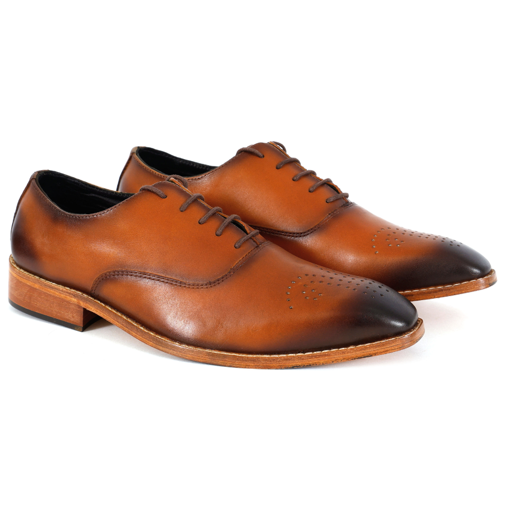 Pair of brown leather dress shoes on a white background