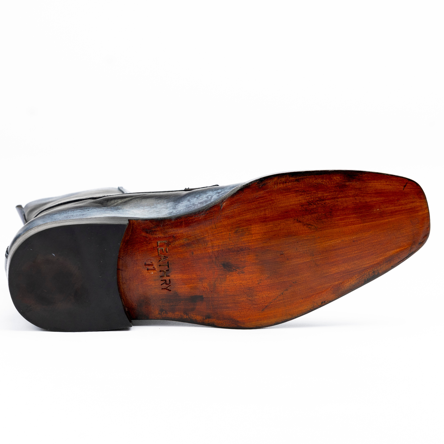 Close-up of a wooden shoe last on a white background
