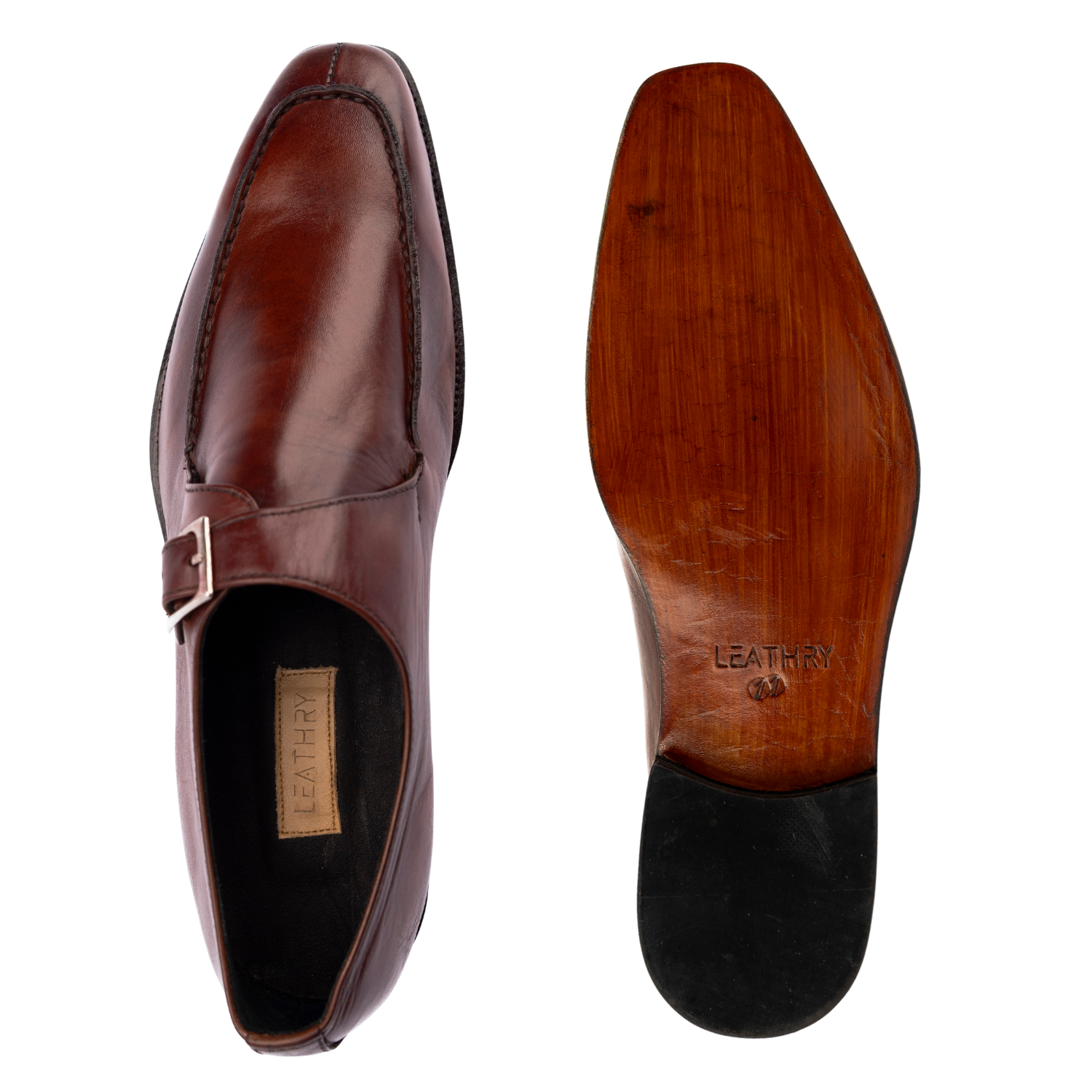 Brown leather dress shoe with a visible brand label on a white background