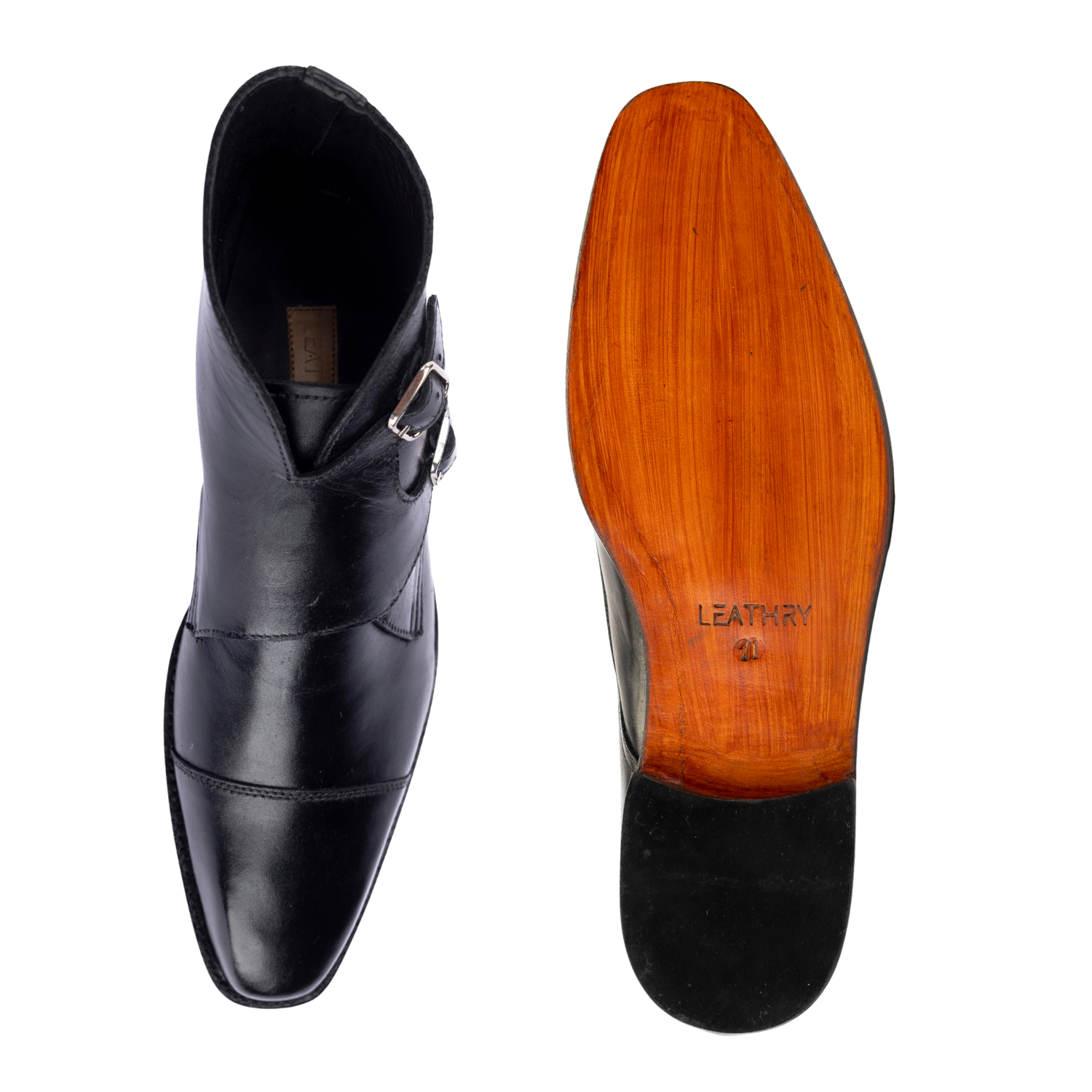 Black leather boot with wooden sole on a white background