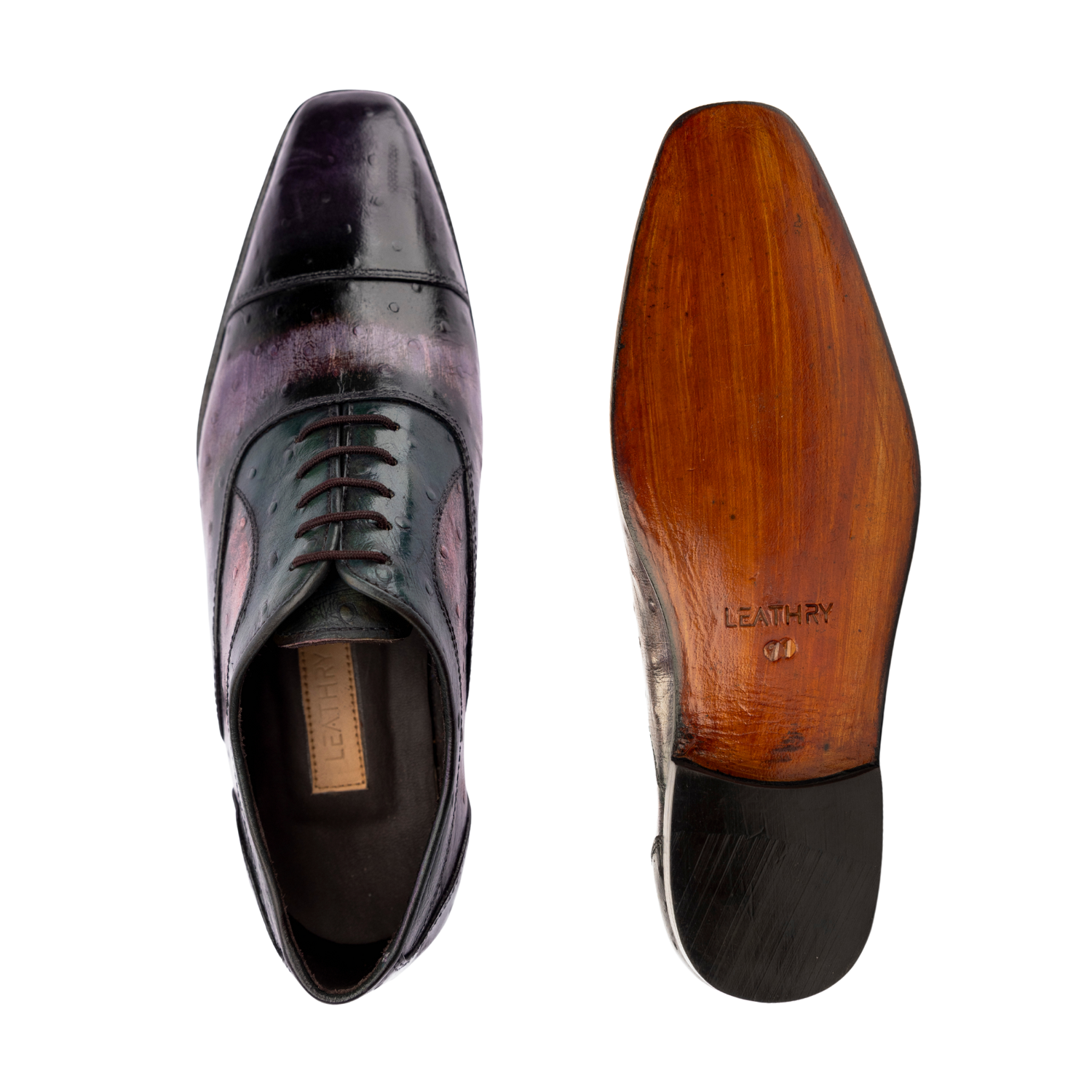 Black dress shoe with wooden sole on a white background