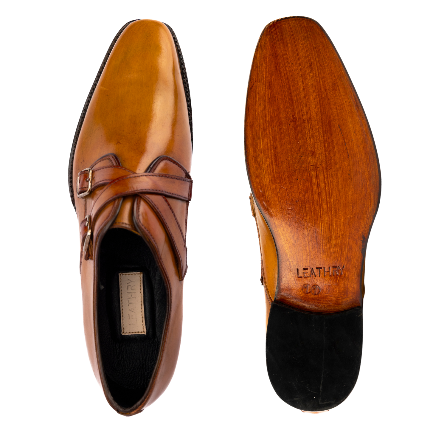 Brown leather dress shoe with a close-up of the sole on a white background