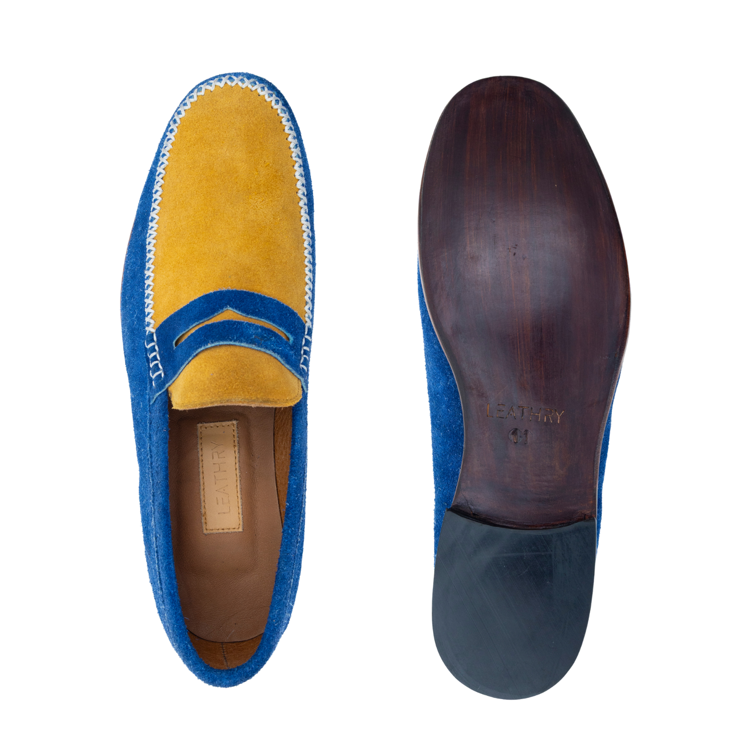 Blue and yellow loafer shoe with sole showing brand name on a white background