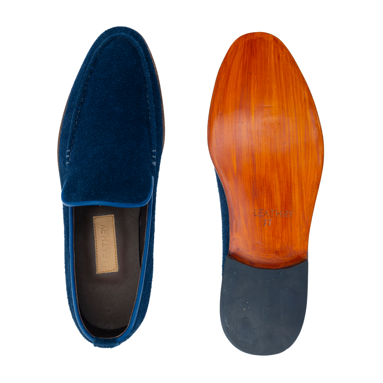 Blue suede loafer with wooden sole on a white background