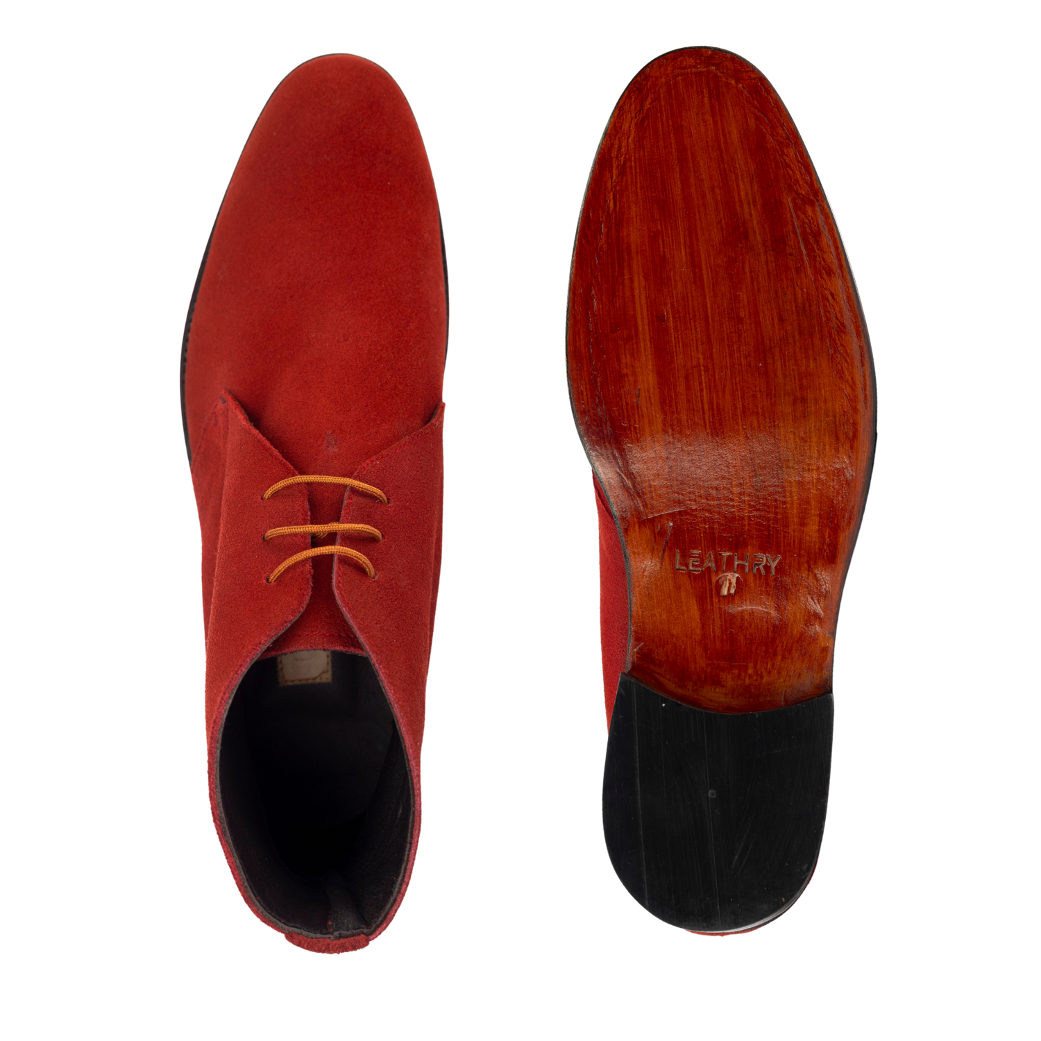 Red suede shoe with wooden sole on a white background