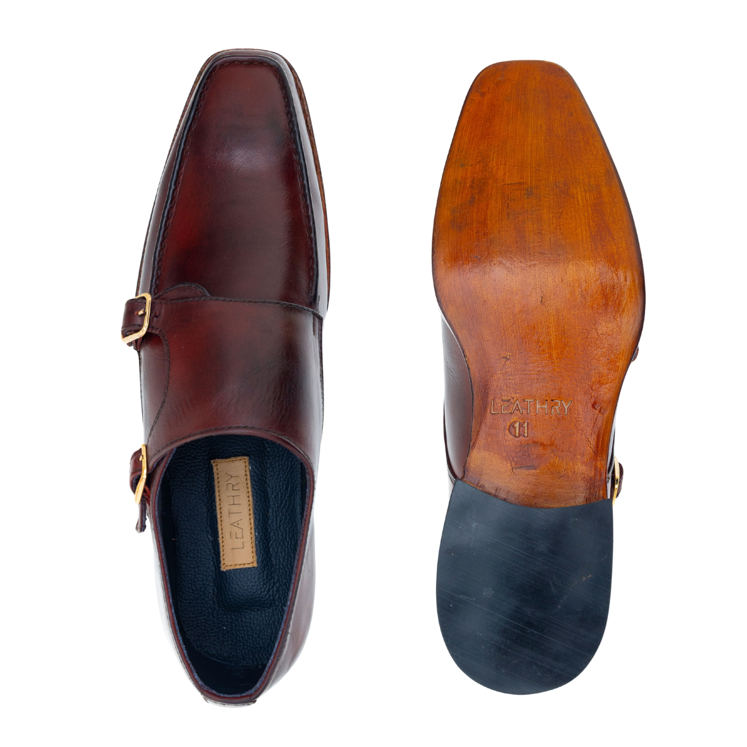Brown leather shoe with gold buckle on a white background