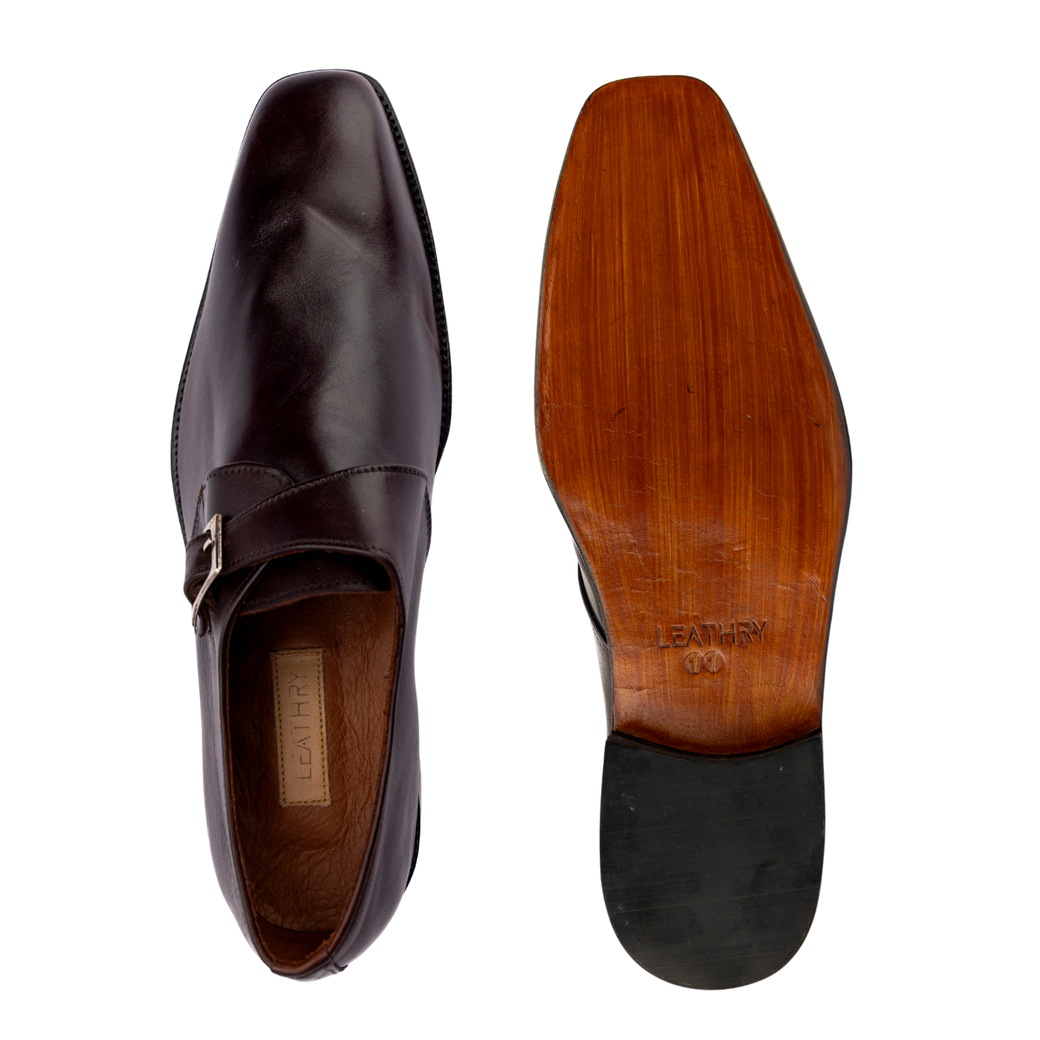 Brown leather shoe with wooden sole on a white background
