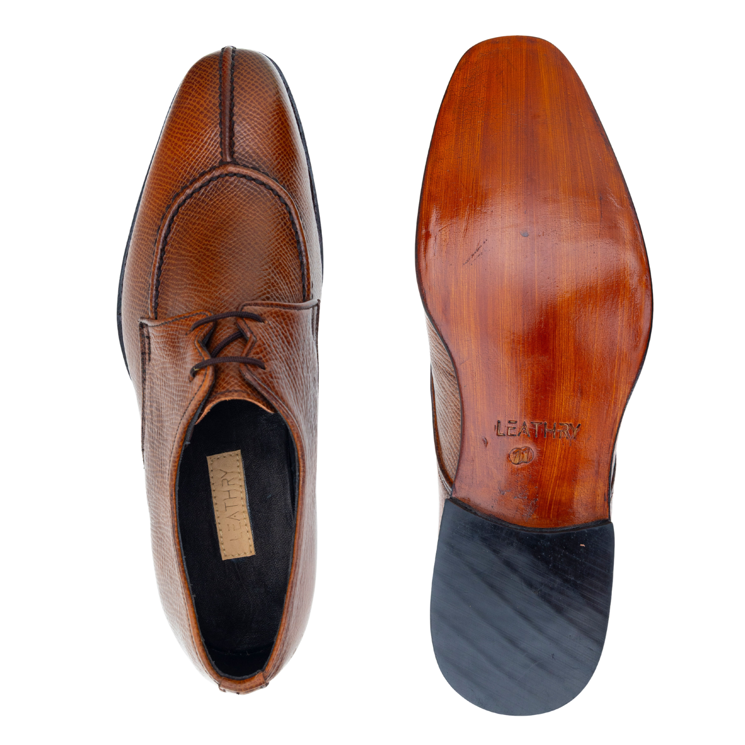 Brown leather shoe with a focus on the sole and brand name on a white background