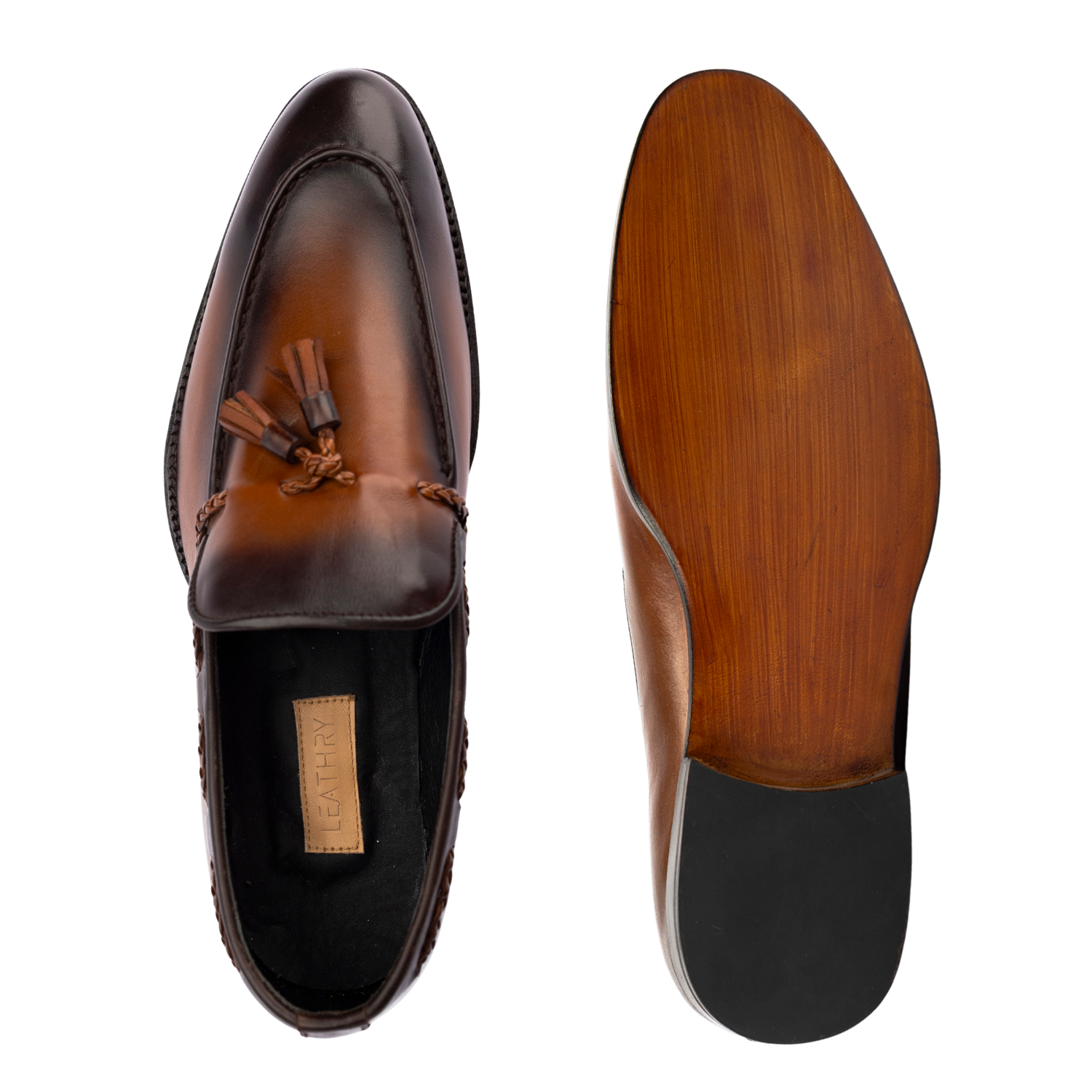 Brown leather loafer with tassel on a white background