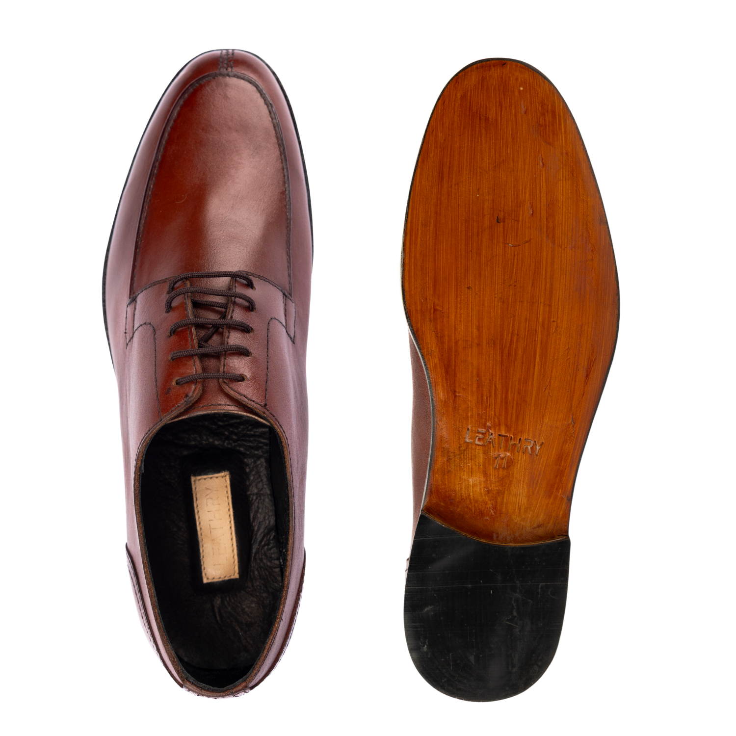Brown leather dress shoe with wooden sole on a white background