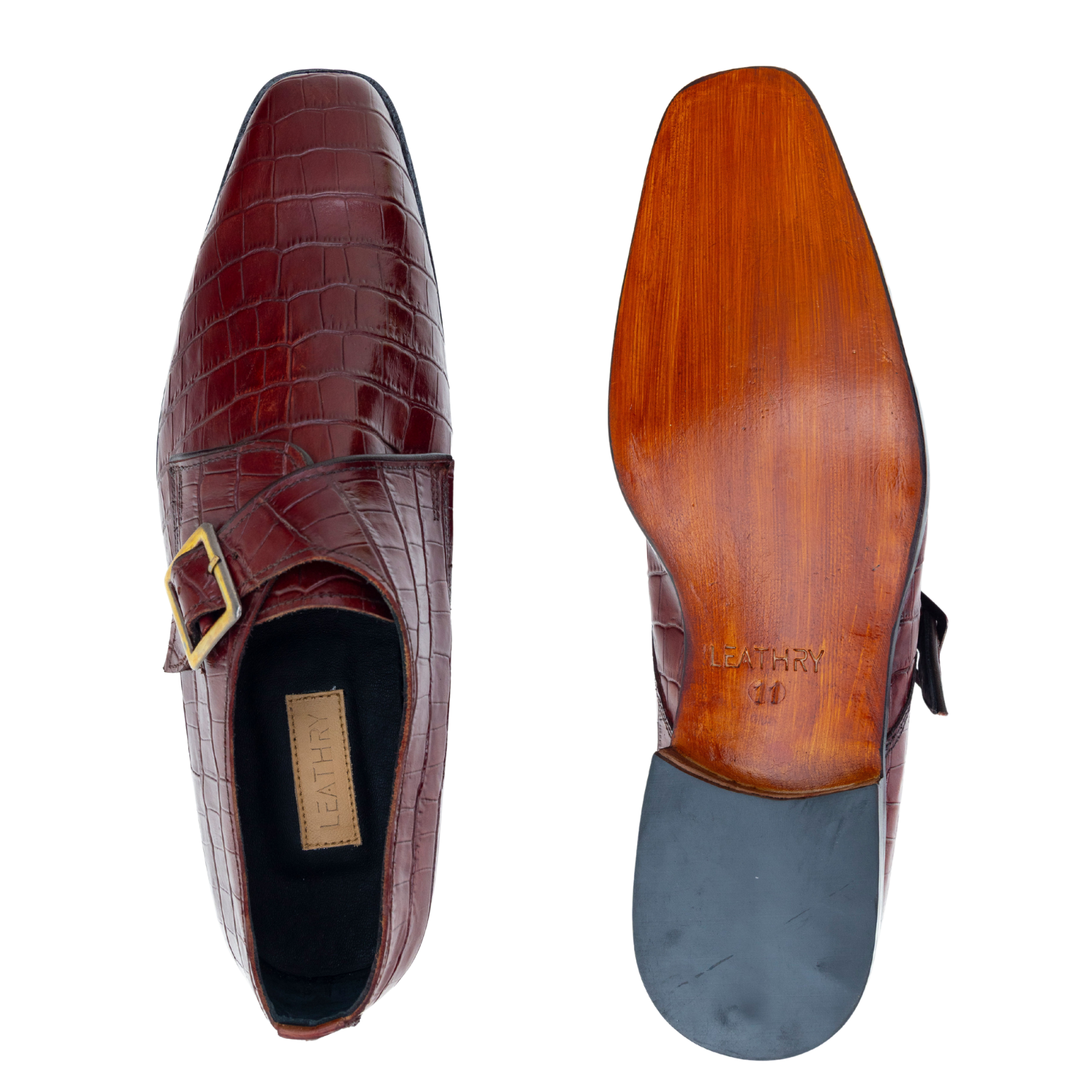 Brown leather shoe with crocodile texture and wooden sole on a white background