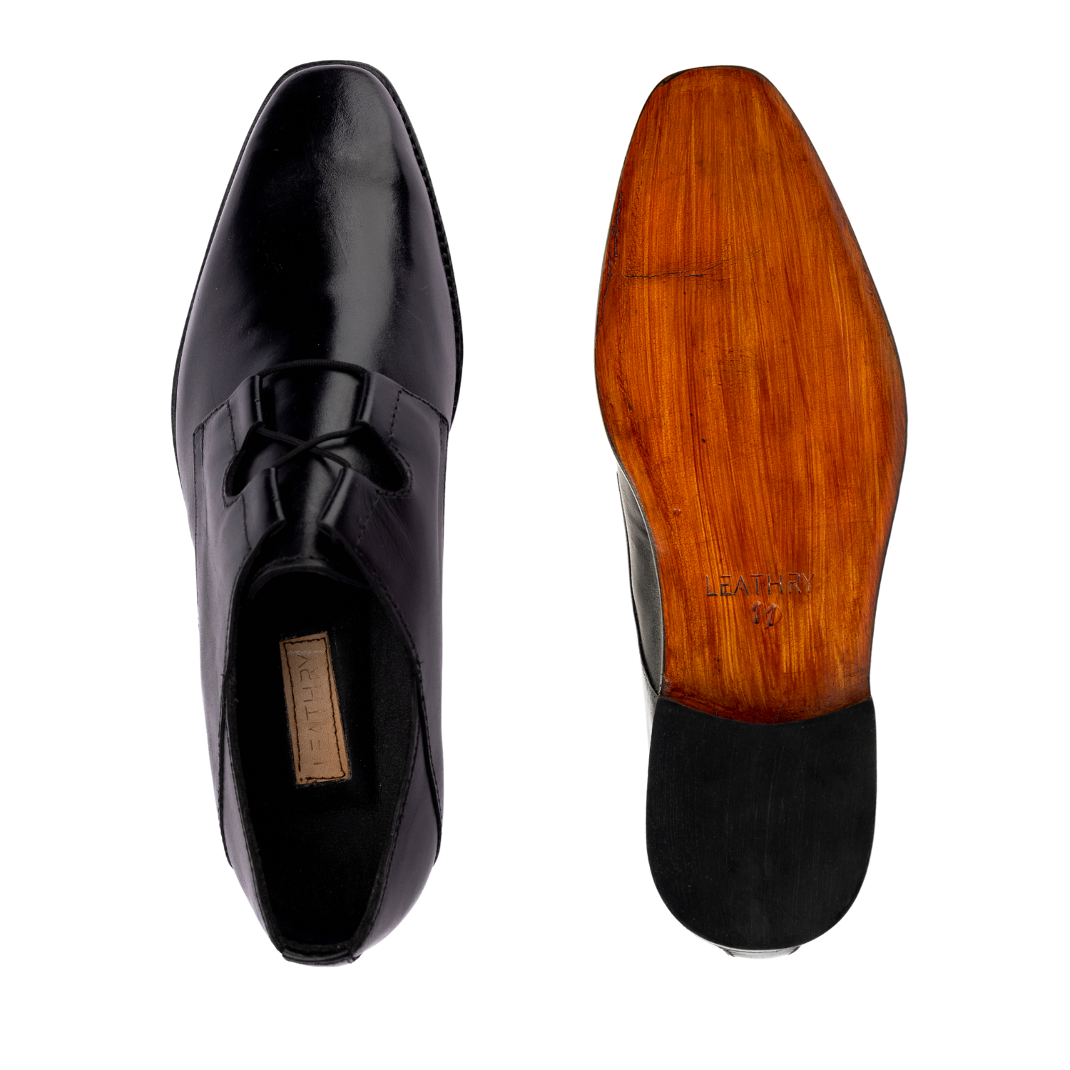 Black patent leather shoe with wooden sole on a white background