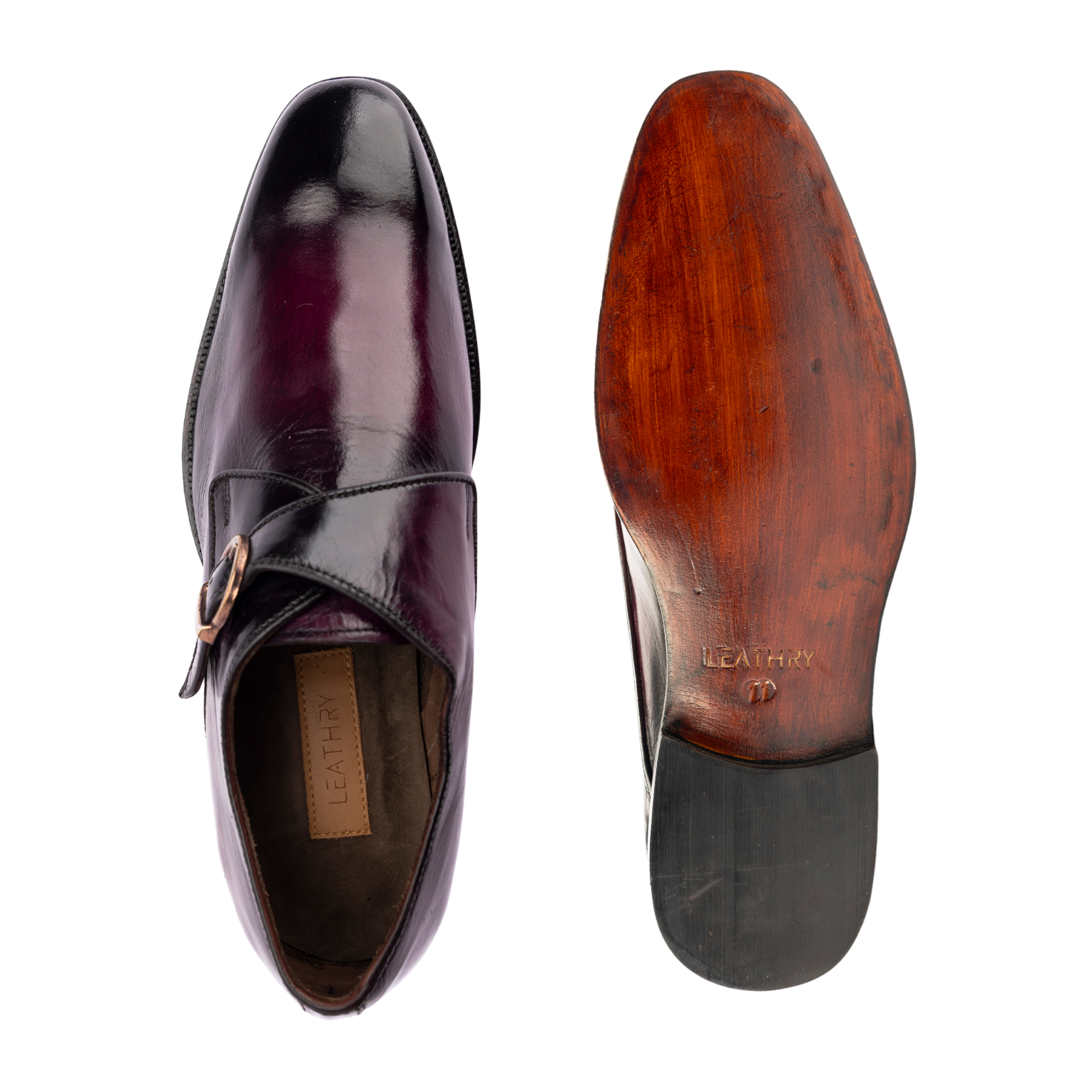 Shiny purple monk strap shoe with a wooden sole on a white background