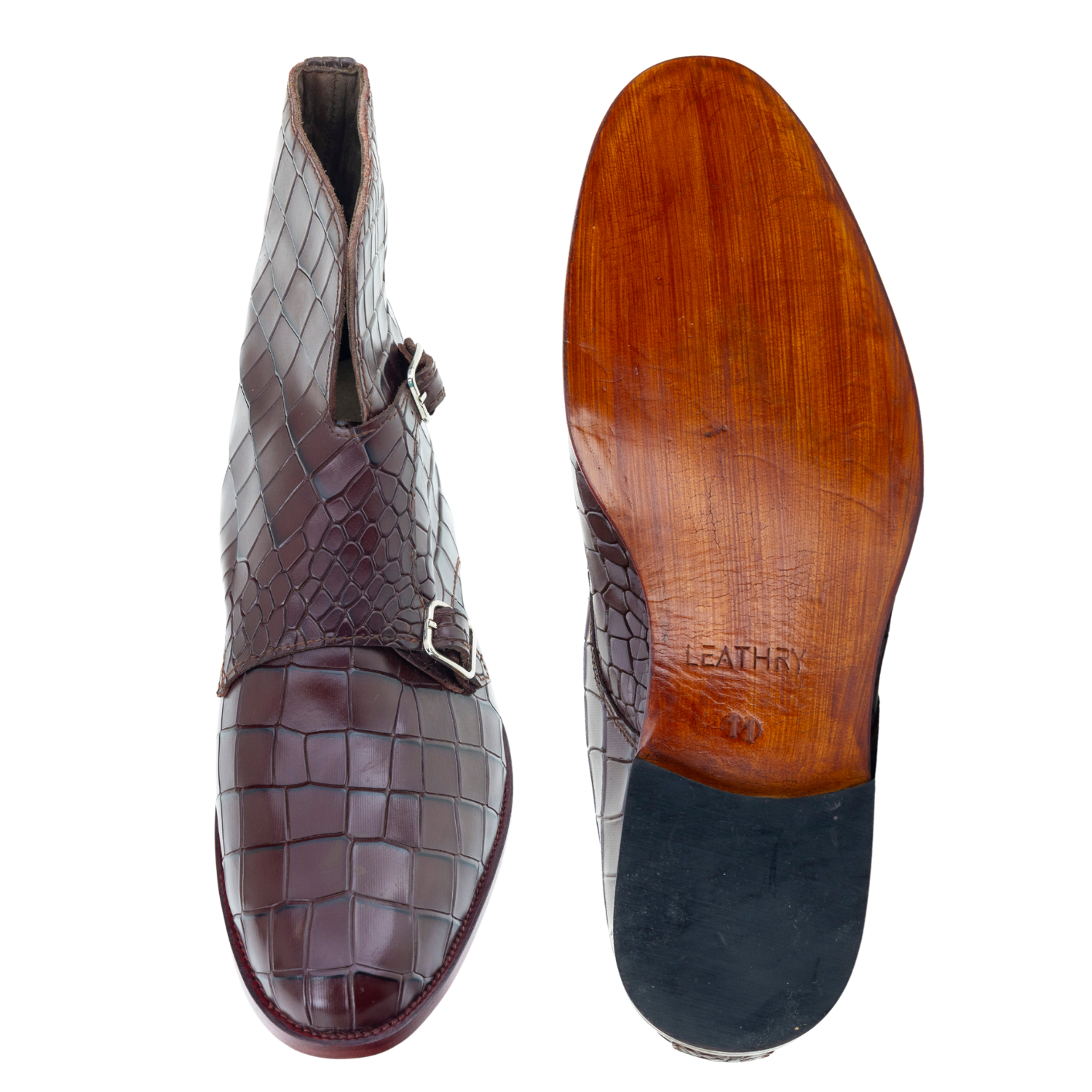 Brown leather shoe with a wooden sole on a white background