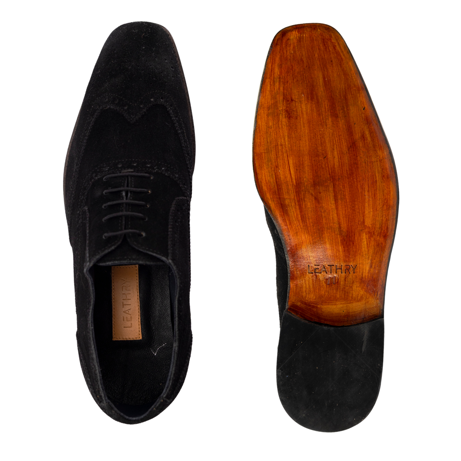 Black suede shoe with wooden sole on a white background