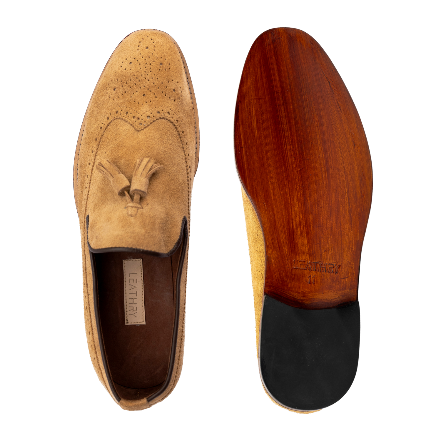 Tan suede loafer with wooden sole on a white background