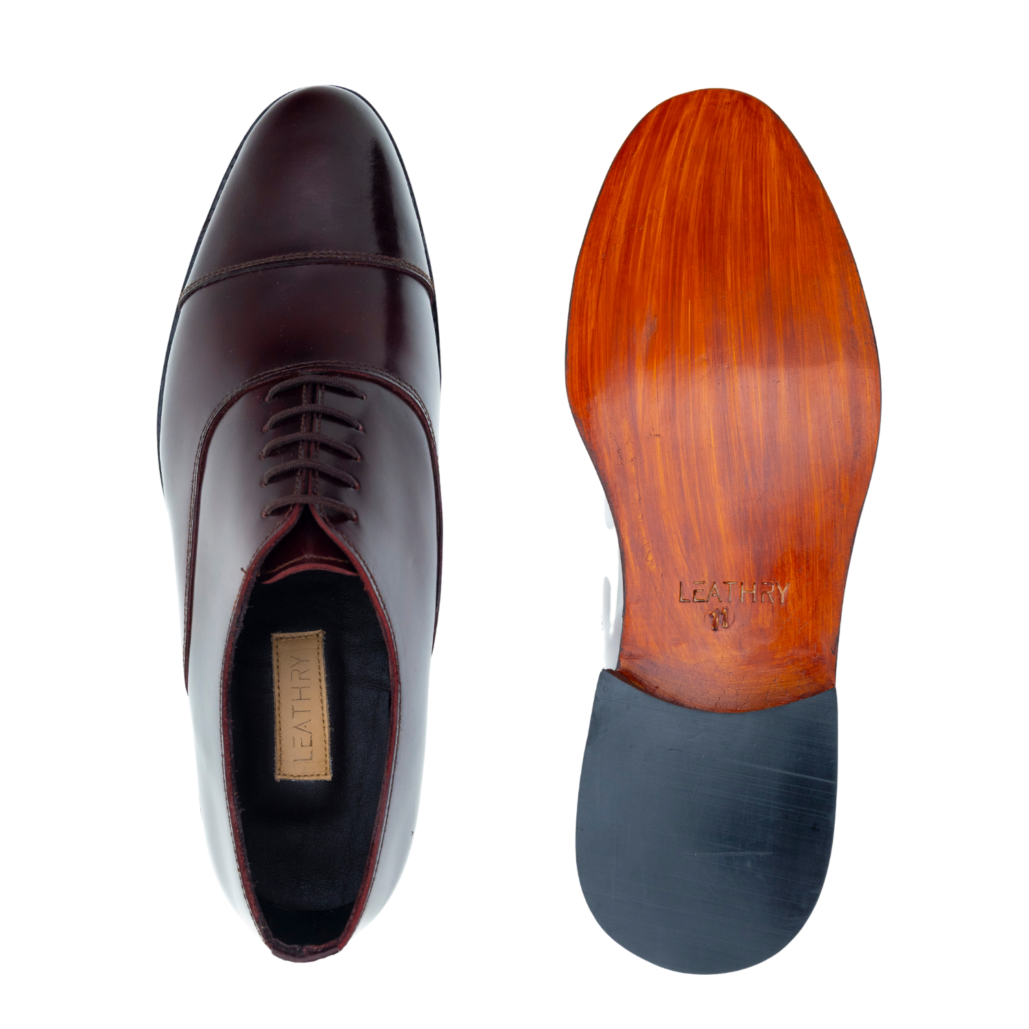 Brown leather shoe with wooden sole on a white background