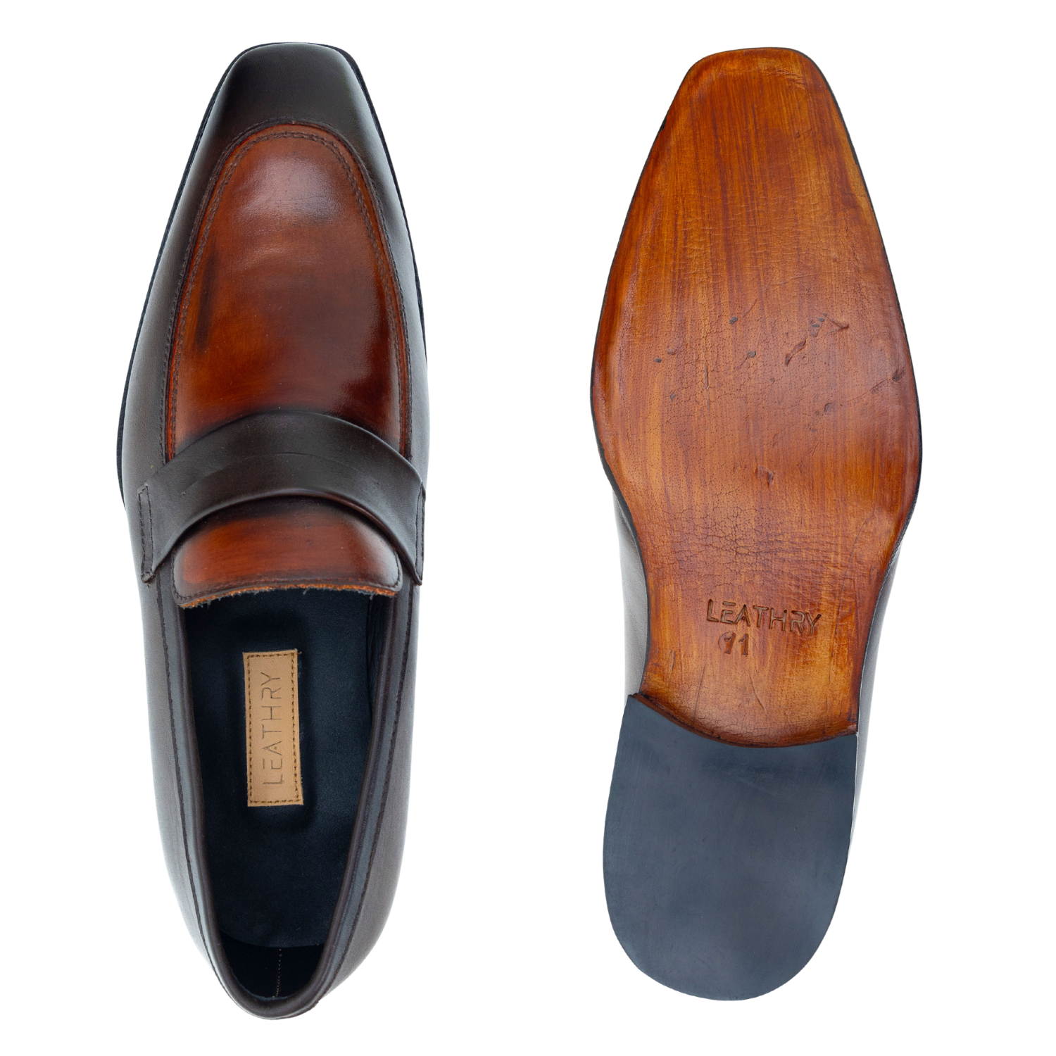 Brown leather loafer with wooden sole on a white background
