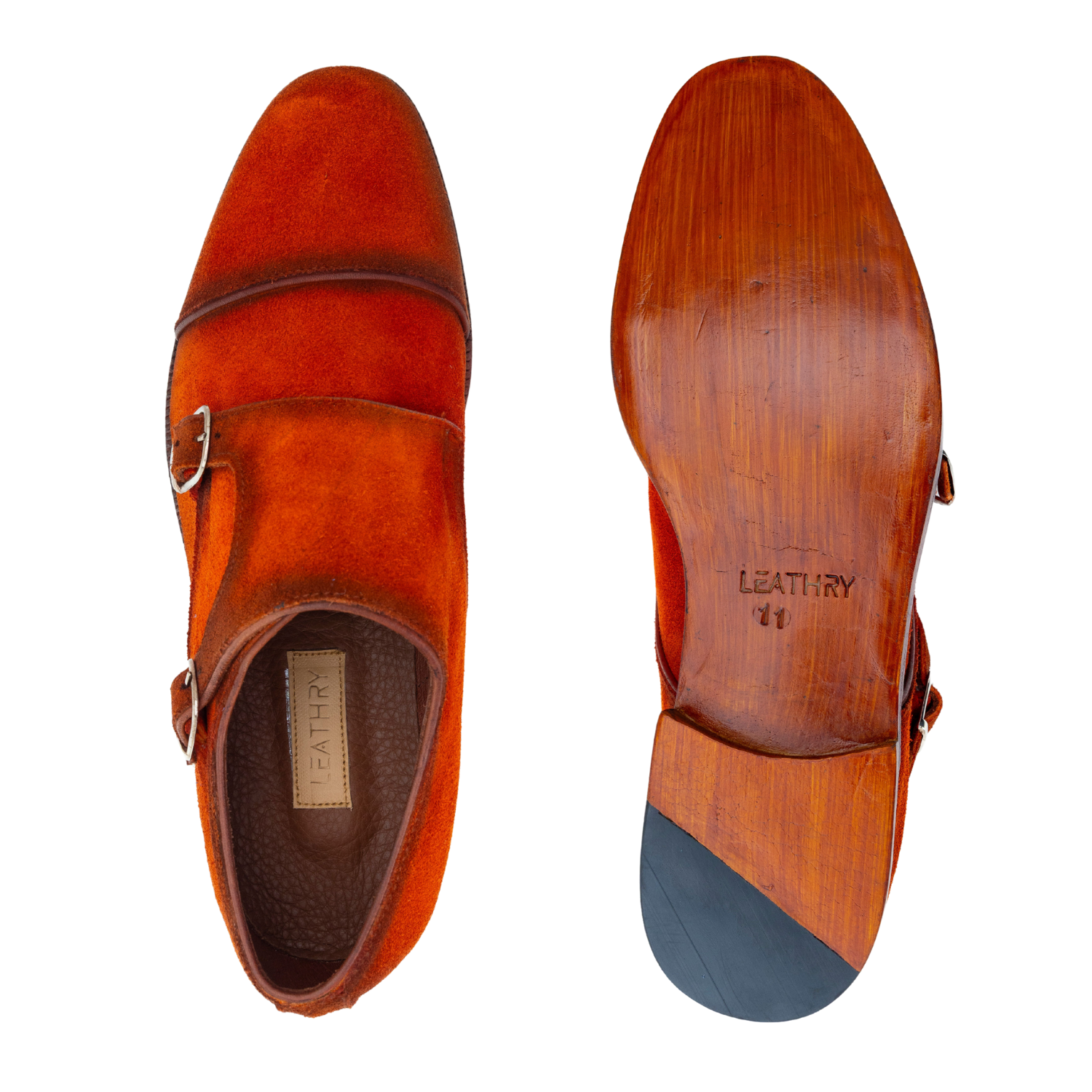Brown leather shoes with a visible brand name on a white background