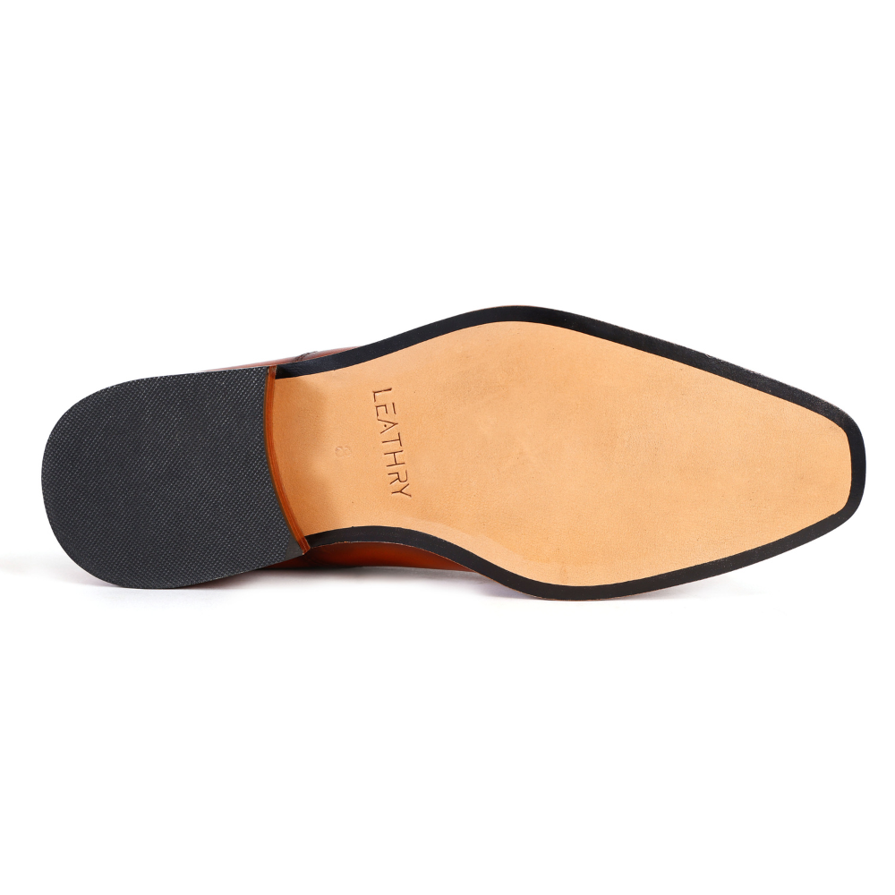 Close-up of a shoe sole with 'Leathry' branding on a white background