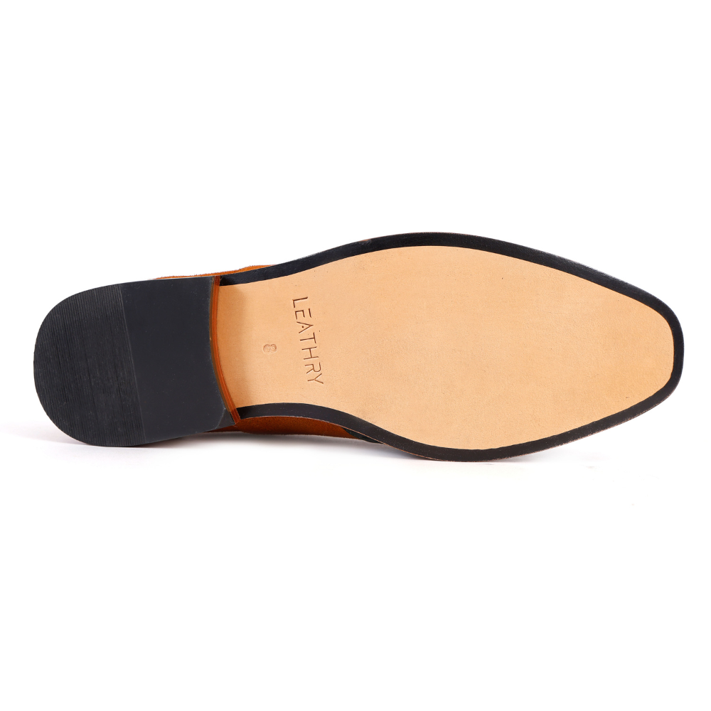 Shoe sole with black rubber outsole and tan leather insole on a white background