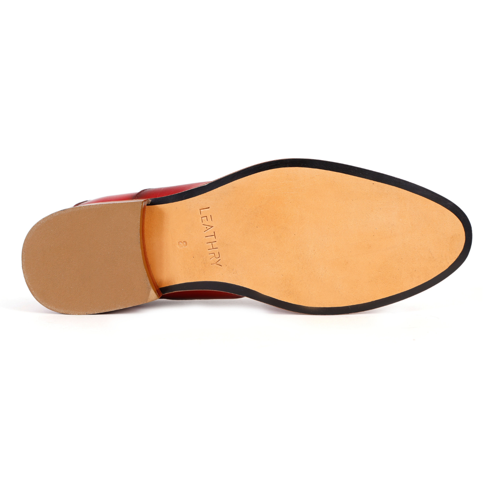 Close-up of a shoe sole with 'Leathery' branding on a white background